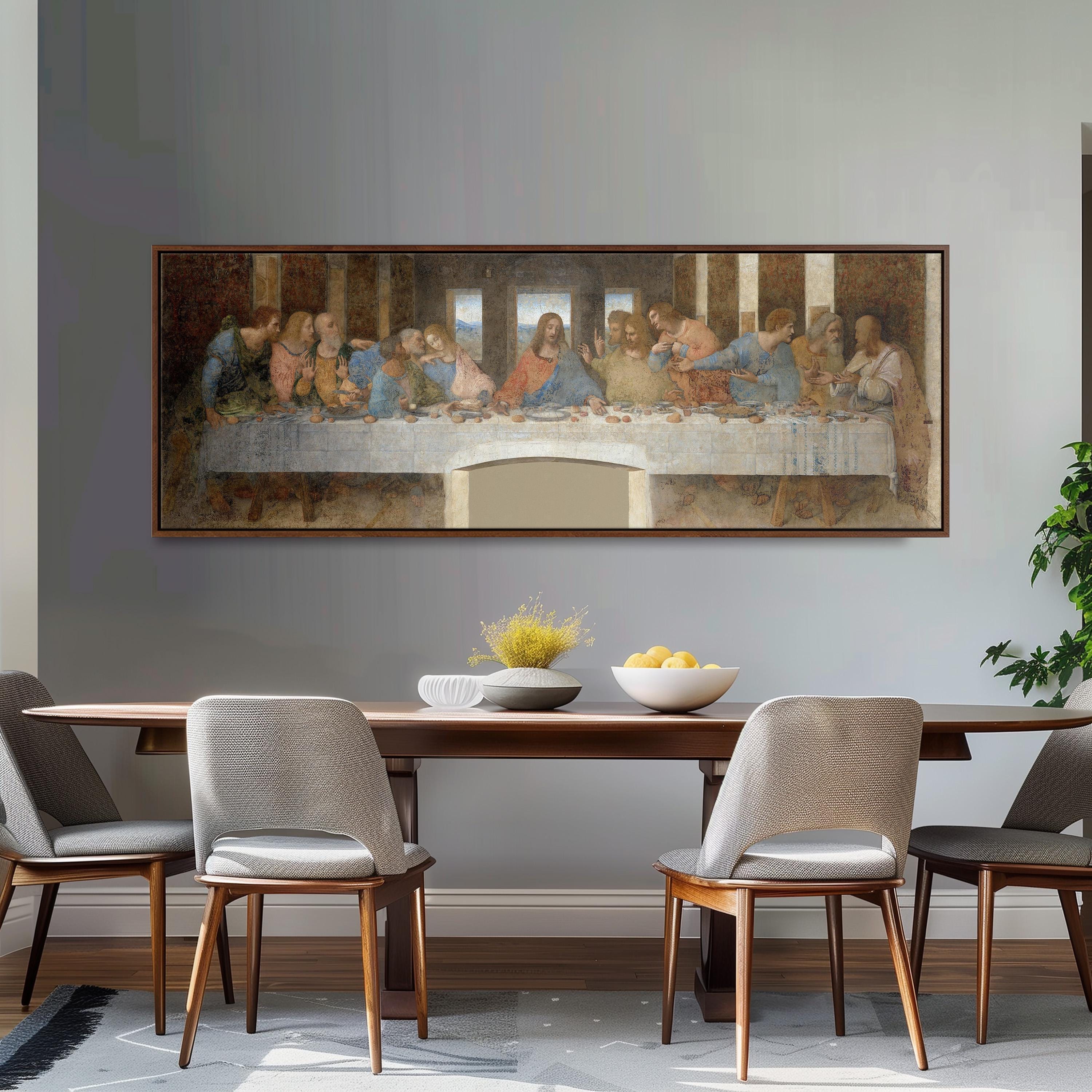 a large painting of the Last Supper hanging on a wall above a wooden dining table with four chairs.