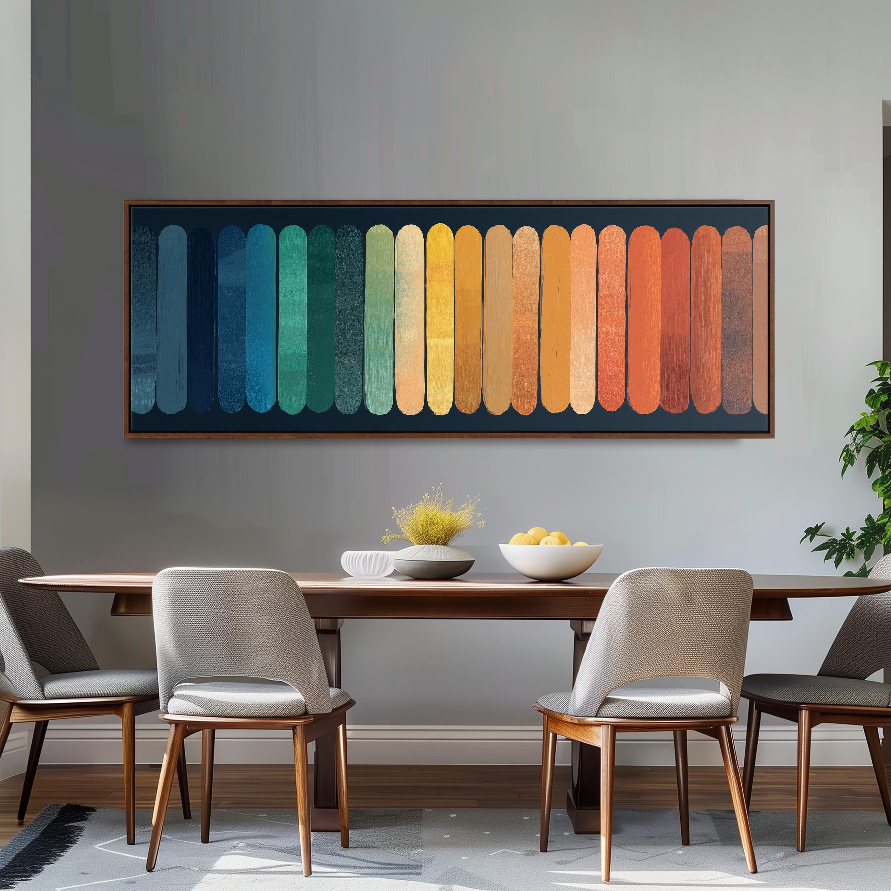 a modern dining room with a wooden table and four chairs. Above the table, there is a large abstract painting with a gradient of colors, creating a vibrant and lively atmosphere. The painting is framed and hangs on the wall, serving as a focal point in the room.