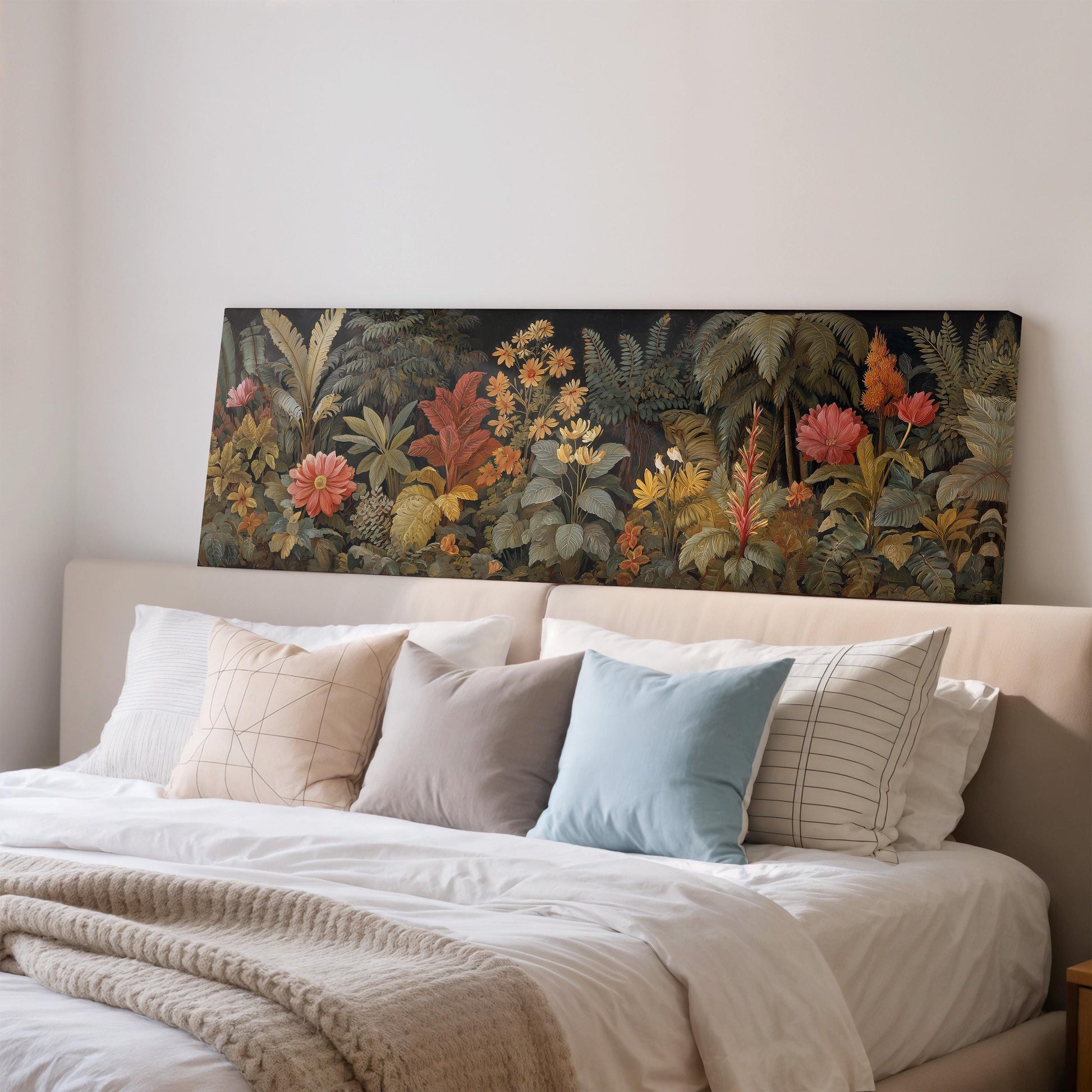 a large, colorful painting of a tropical garden hanging above a bed with white pillows and a gray blanket.