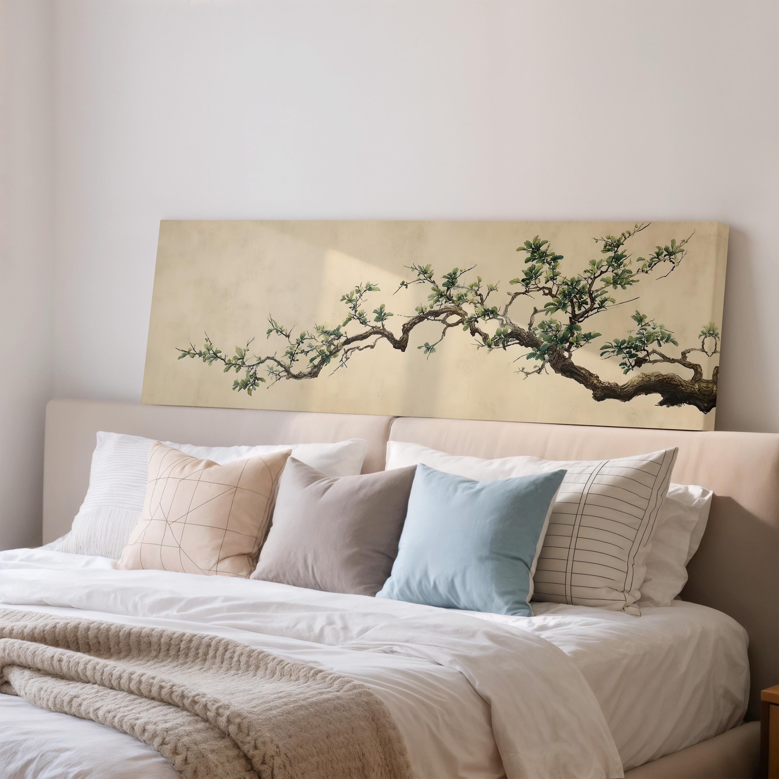 a bedroom with a large bed adorned with white linens and a single decorative pillow. Above the bed, there is a large painting of a tree with a branch extending over the bed.
