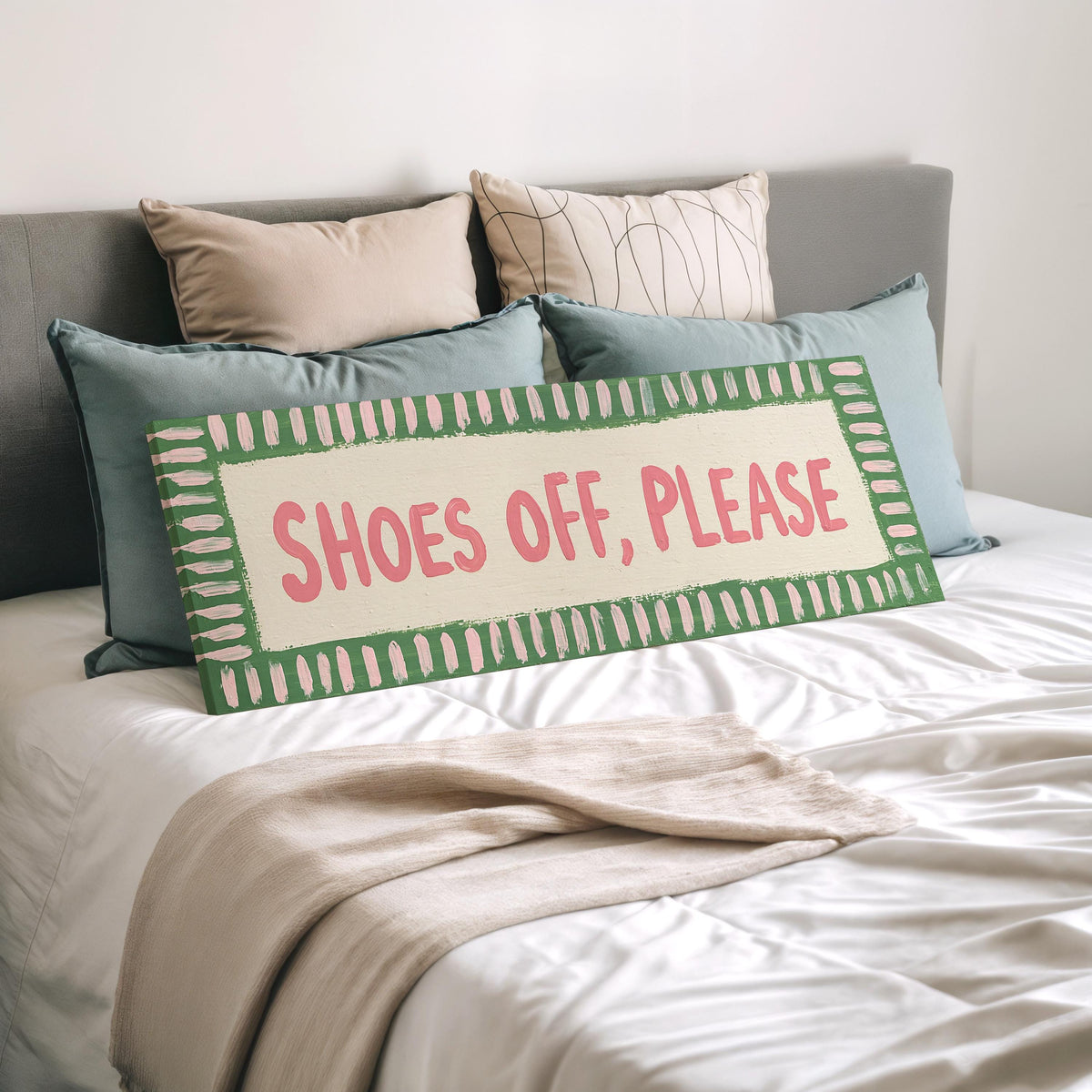 Shoes off, please sign wide panoramic canvas print laid on a bed to show its size