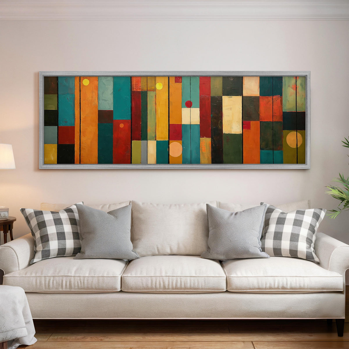 Color block panels with dots panoramic canvas print above a white sofa in a bright living room