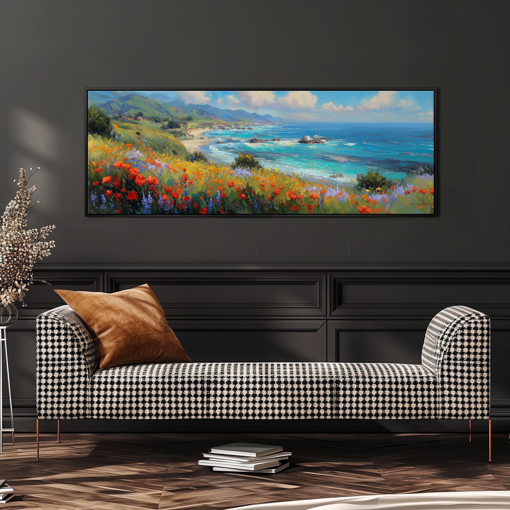 a large, colorful painting of a coastal landscape hanging on a wall above a black and white checkered sofa.