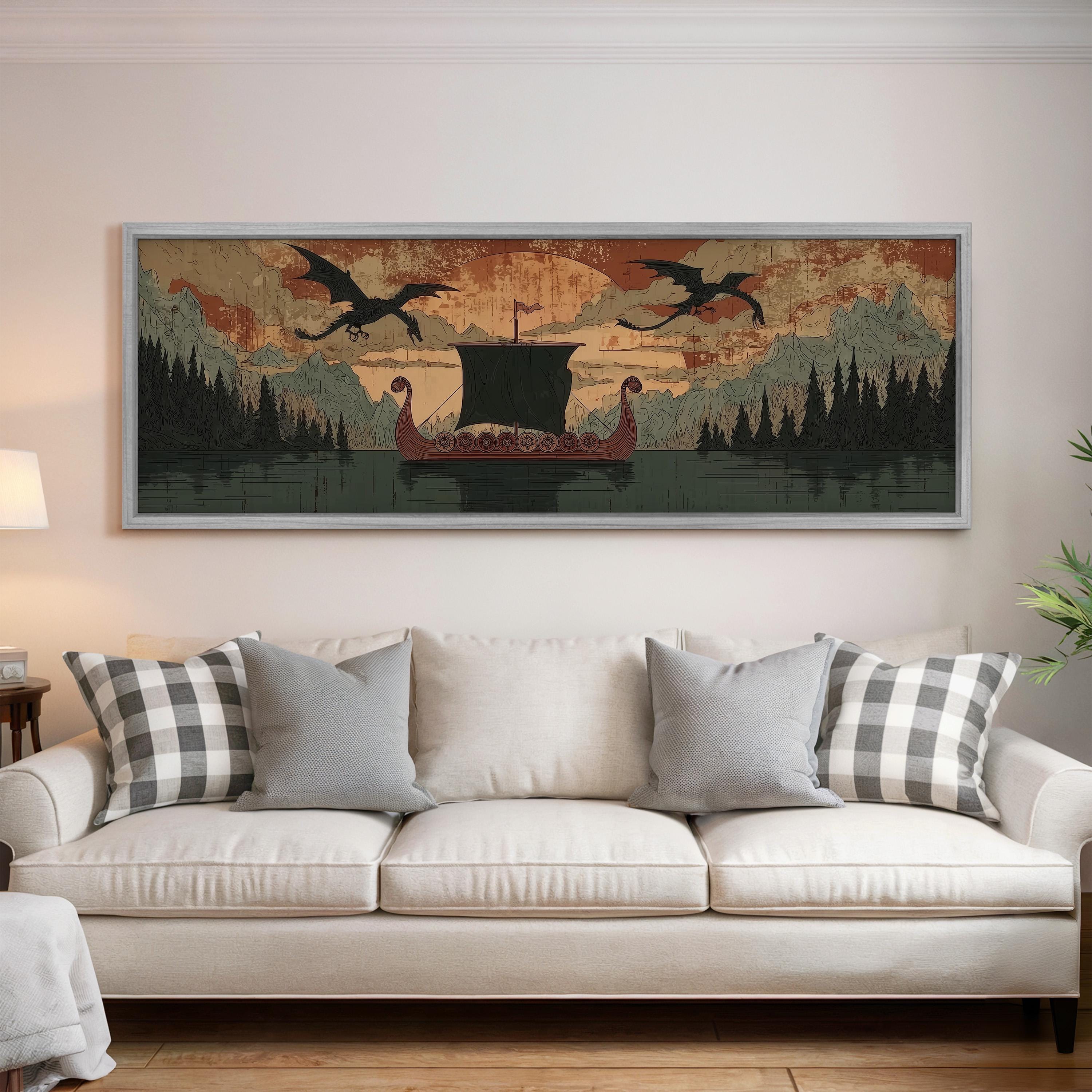 a large, framed artwork depicting a boat sailing on a lake, with two dragons flying above it. The artwork is mounted on a wall above a white couch, which is positioned in front of the frame.