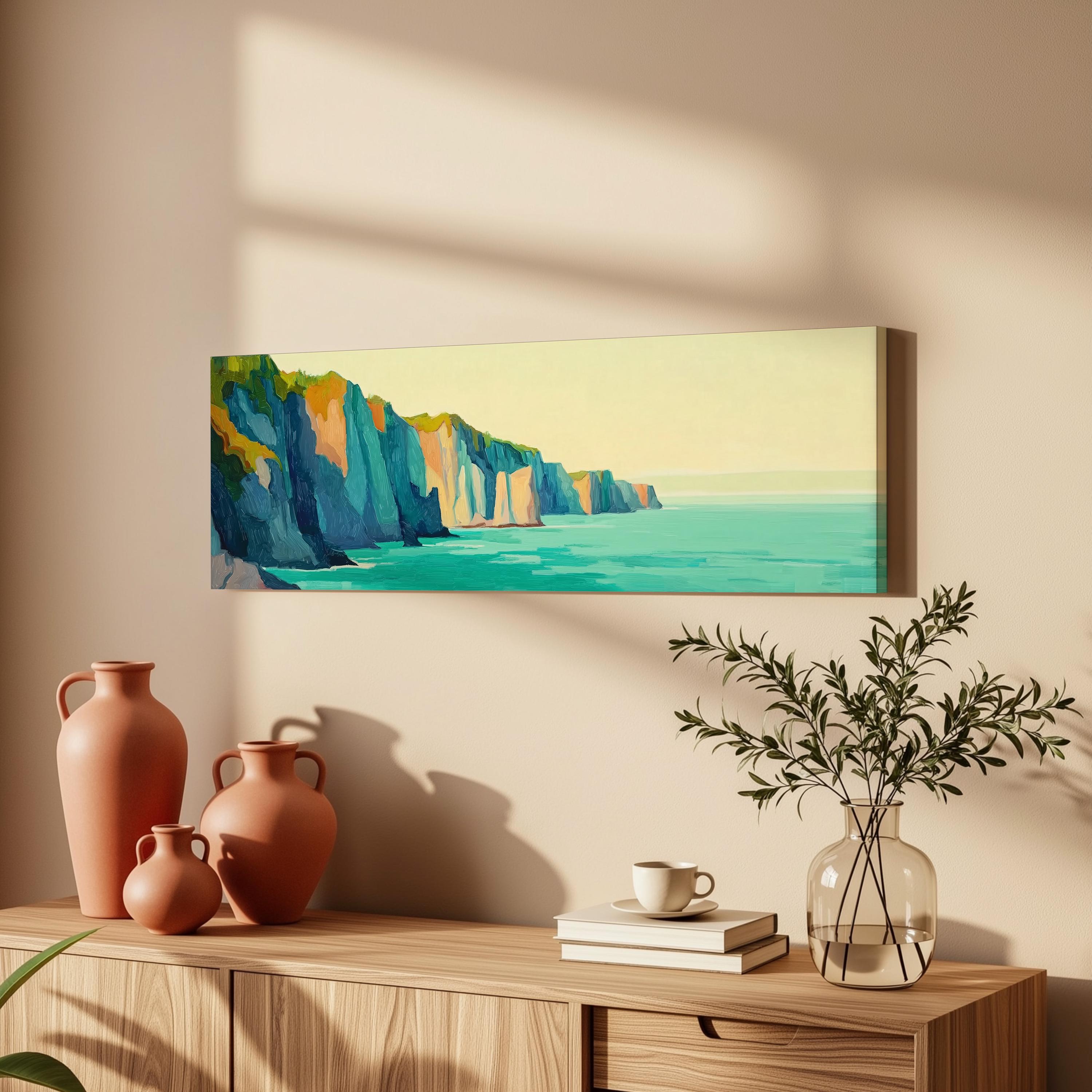 a wooden cabinet with a painting of cliffs and a vase of greenery on top, along with a stack of books and a coffee cup on the shelf.