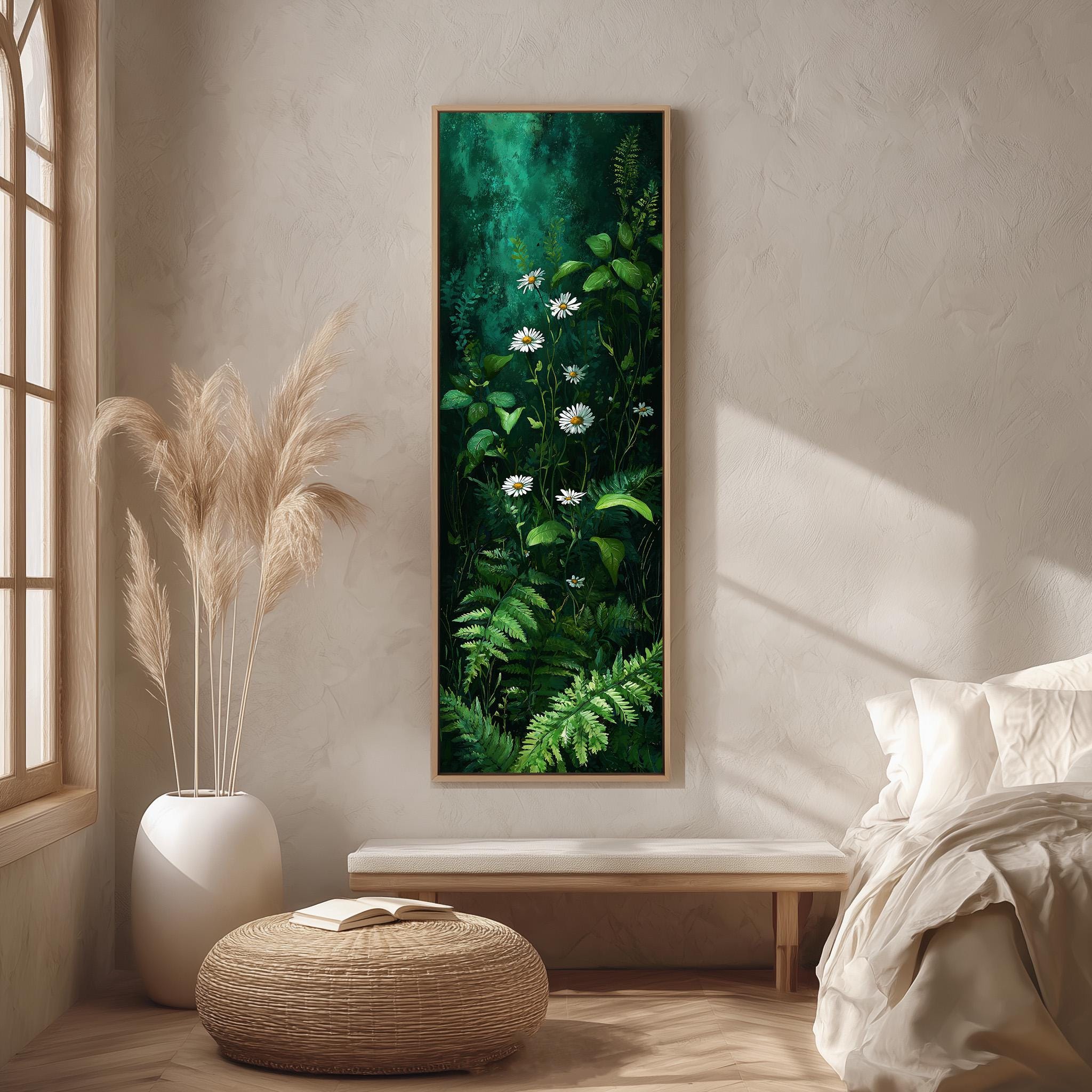 a serene and cozy bedroom scene, featuring a large painting of lush green foliage and white flowers hanging on the wall, a white bed with a white pillow, a white vase with tall potted plants, and a woven ottoman in front of the bed.