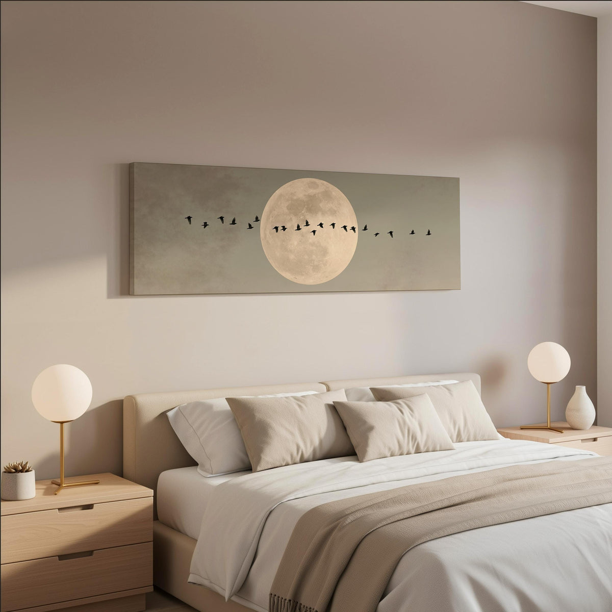 Geese crossing a full moon on grey wide panoramic canvas print above a bed in a neutral bedroom