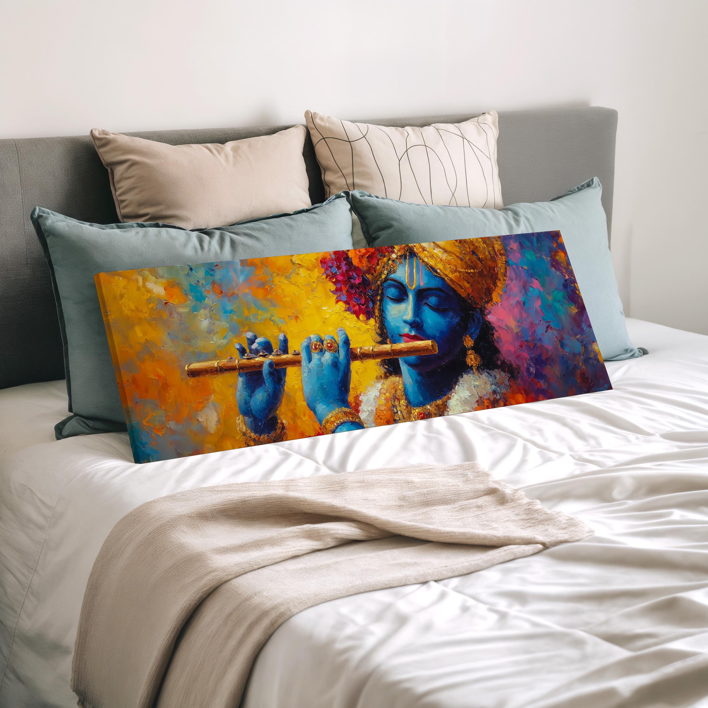 a large painting of a blue-skinned Hindu deity playing a flute, displayed on a bed with pillows.