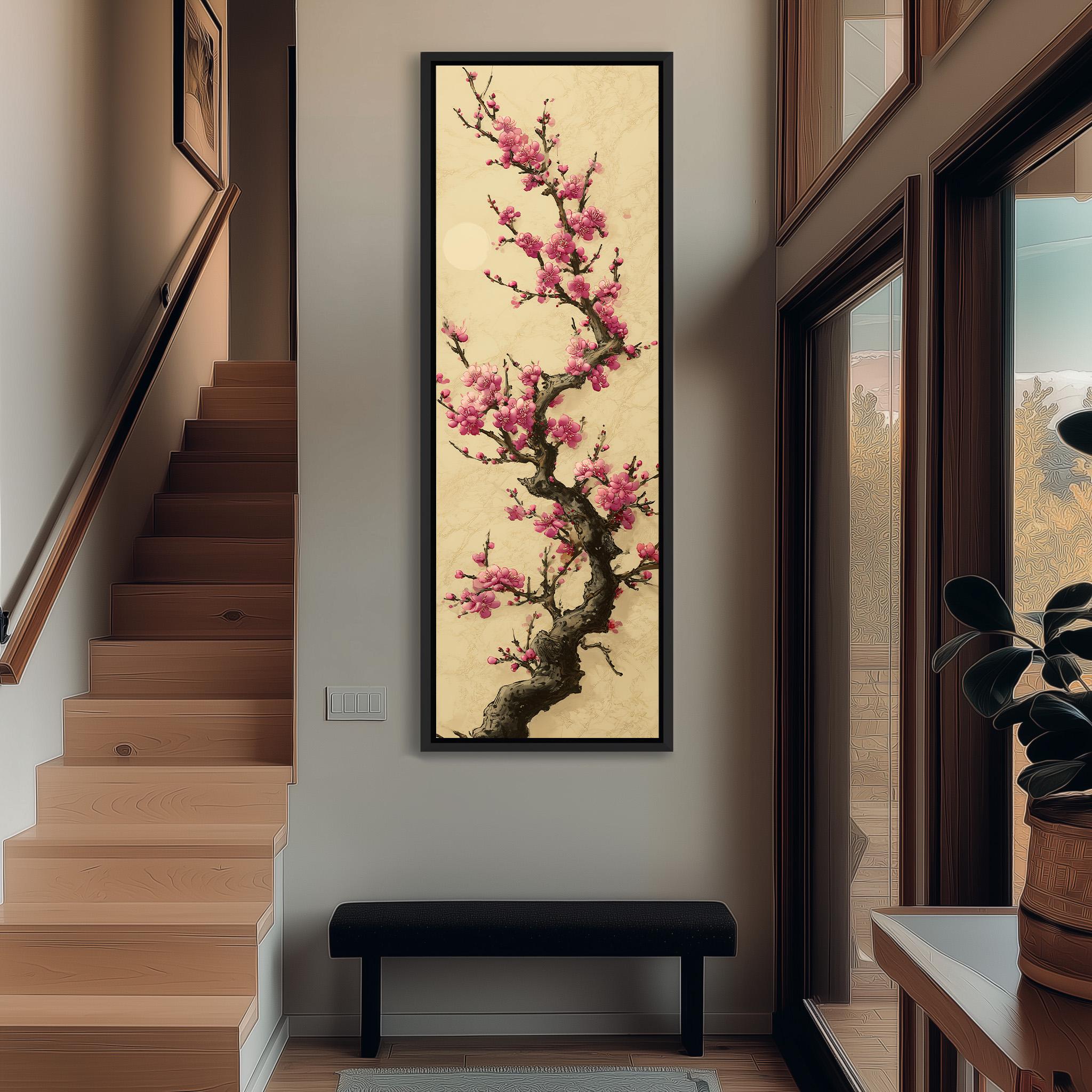 a large, framed painting of a cherry blossom tree with pink flowers hanging on the wall of a hallway. The painting is the focal point of the space, with a wooden staircase visible in the background.