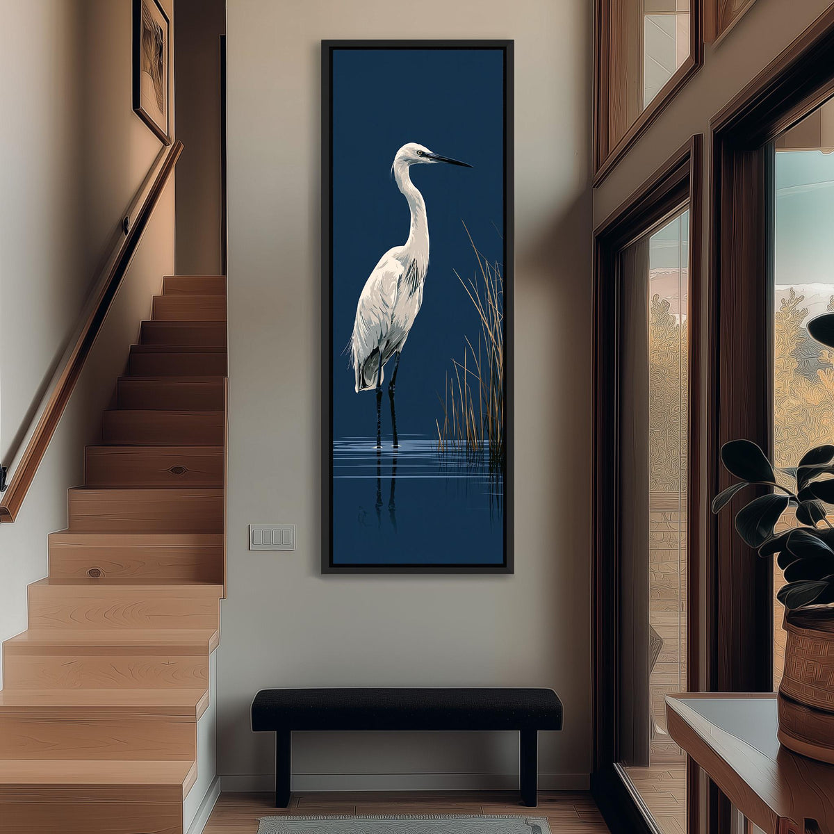 White egret wading on navy tall narrow canvas print beside a staircase in an entryway