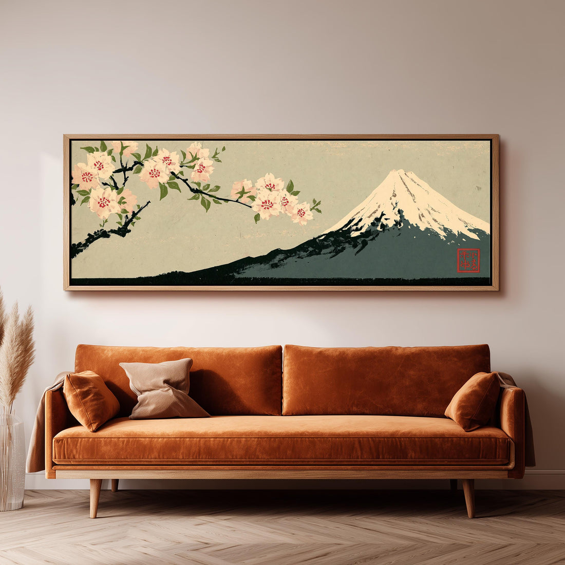 Cherry blossom branch and Mount Fuji long horizontal canvas print above a sofa in a living room