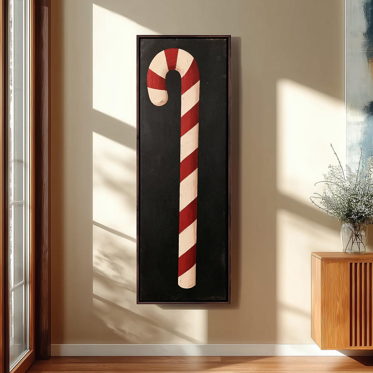Single candy cane on black long vertical canvas print in a sunlit living space