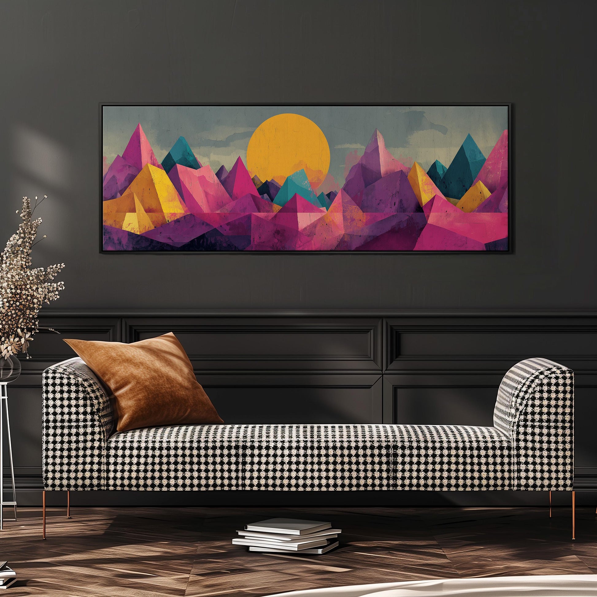 a modern living room with a black and white checkered sofa, a stack of books, and a large abstract landscape painting hanging on the wall above the sofa.