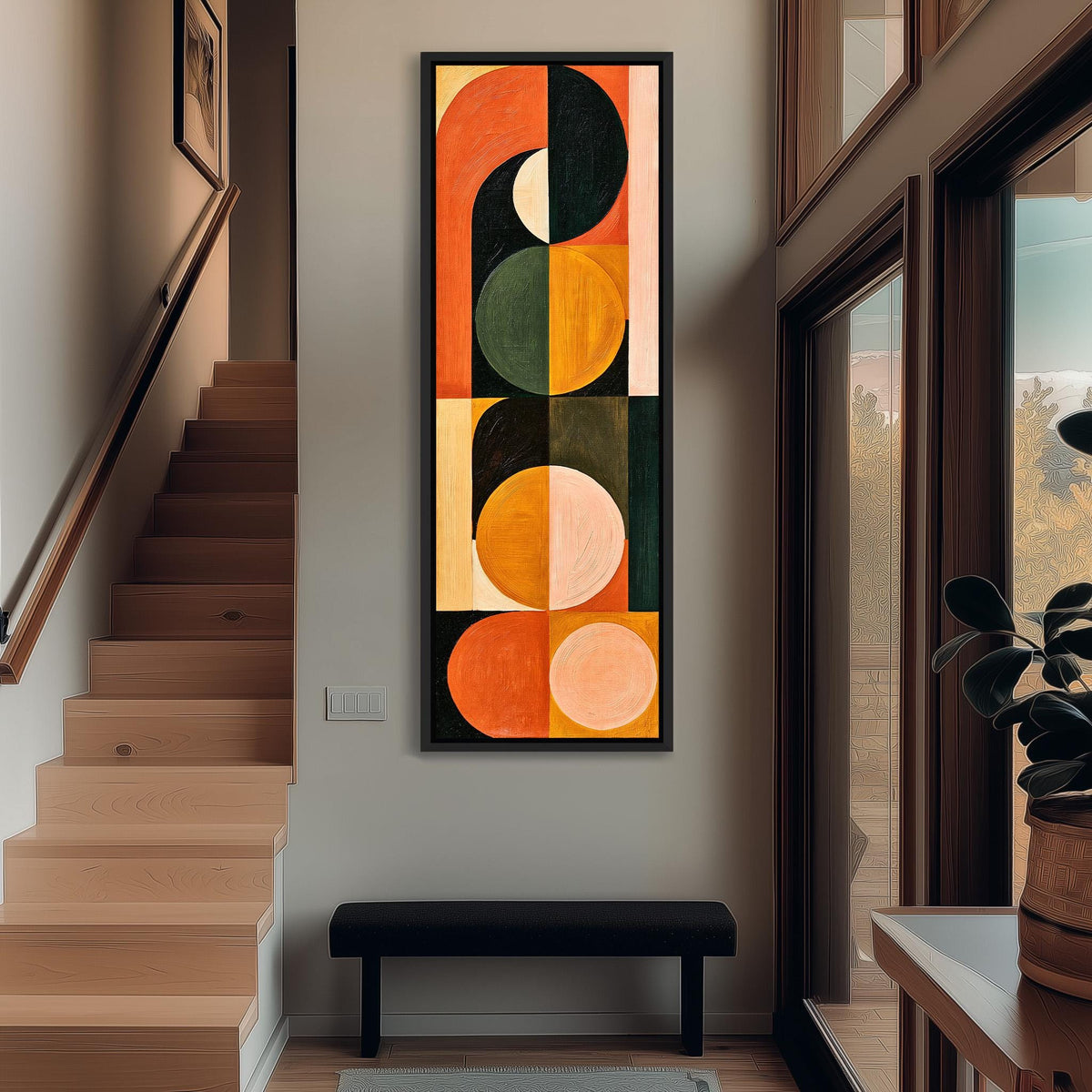 Stacked half moons and circles in orange and olive tall narrow canvas print beside a staircase in an entryway