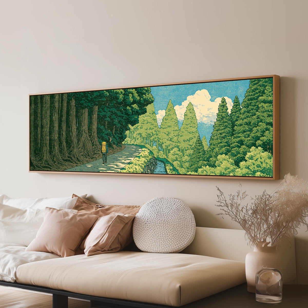 Hiker on a forest trail panoramic canvas print above a sofa in a living room