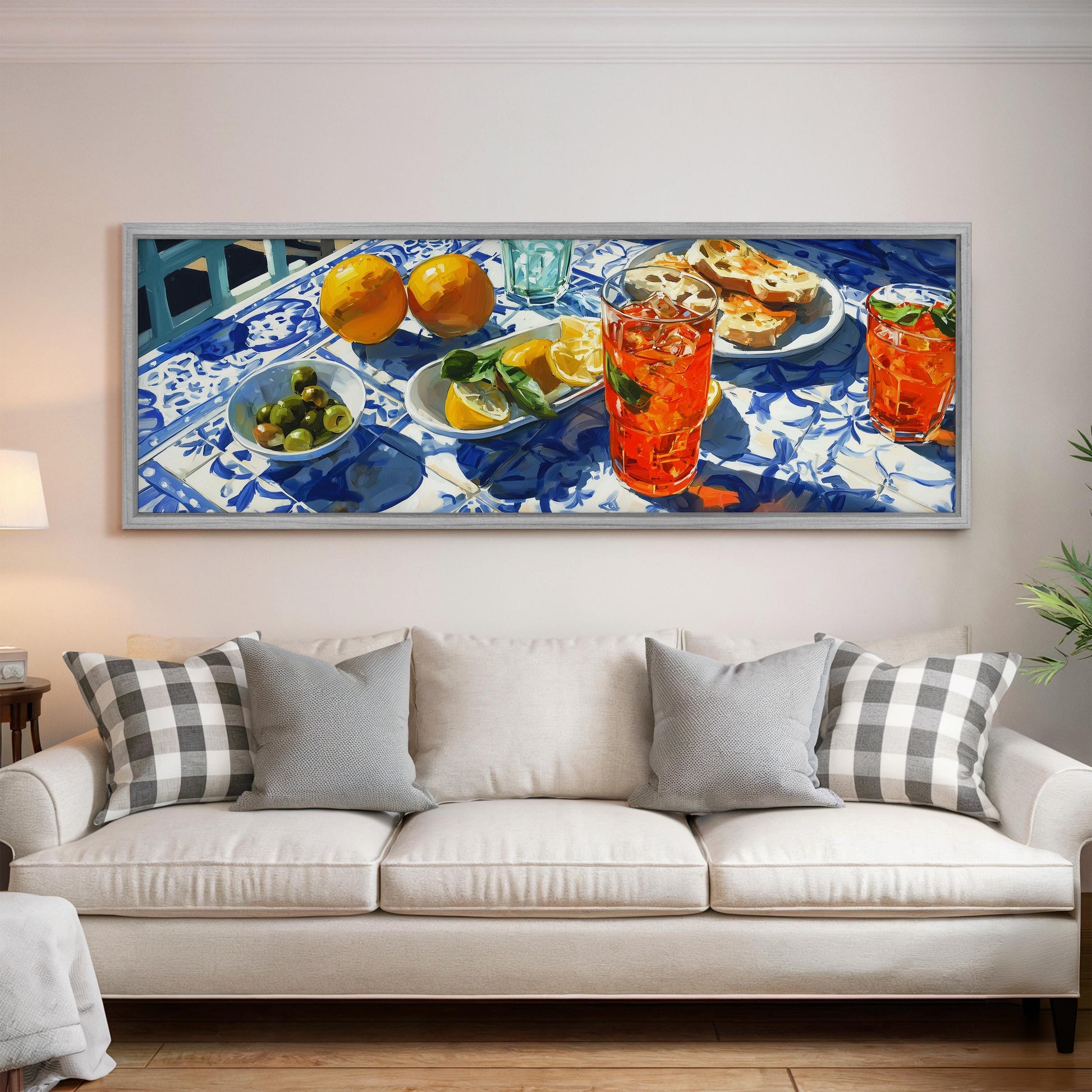 a large painting of a table with various food items and drinks, including oranges, lemon slices, and glasses of orange and lemonade.