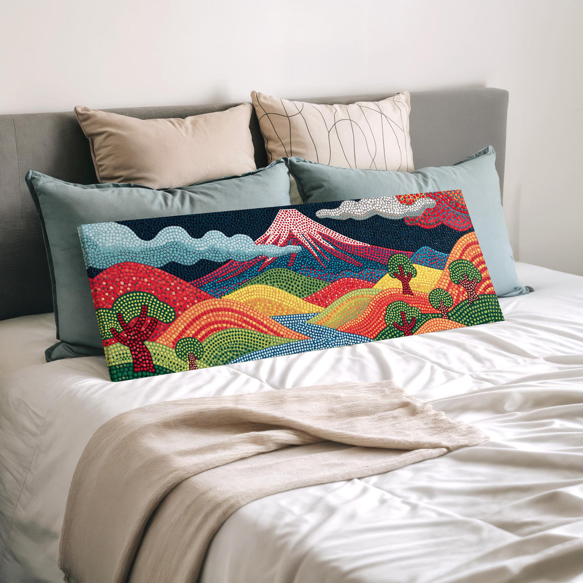 Mount Fuji above rainbow dotted hills wide panoramic canvas print laid on a bed to show its size