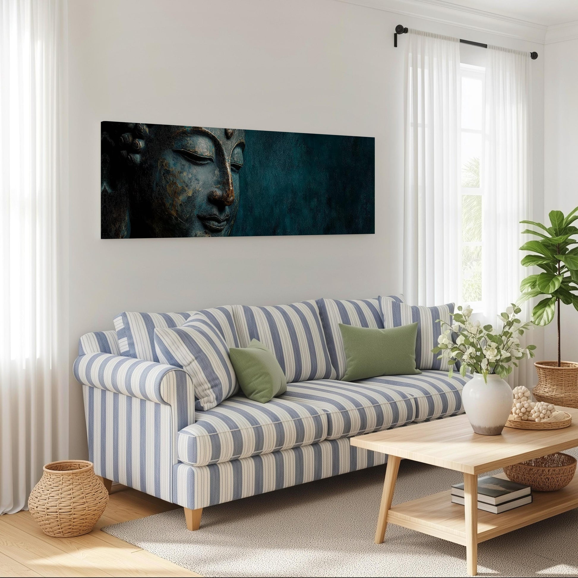 a living room with a blue and white striped sofa, a wooden coffee table, and a large Buddha portrait on the wall.