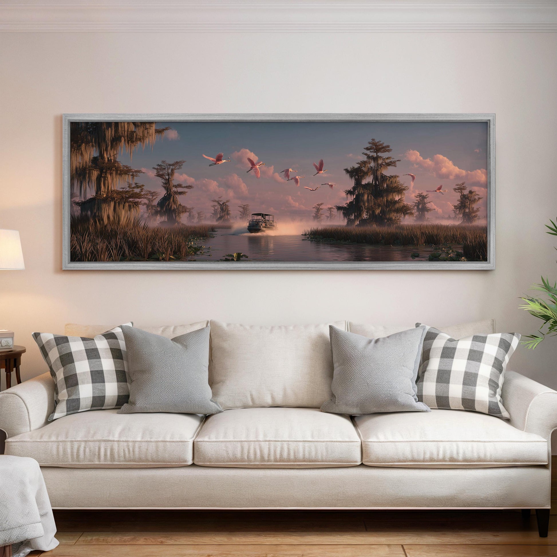a large framed painting of a serene landscape with a boat on a river, surrounded by trees and birds flying overhead.