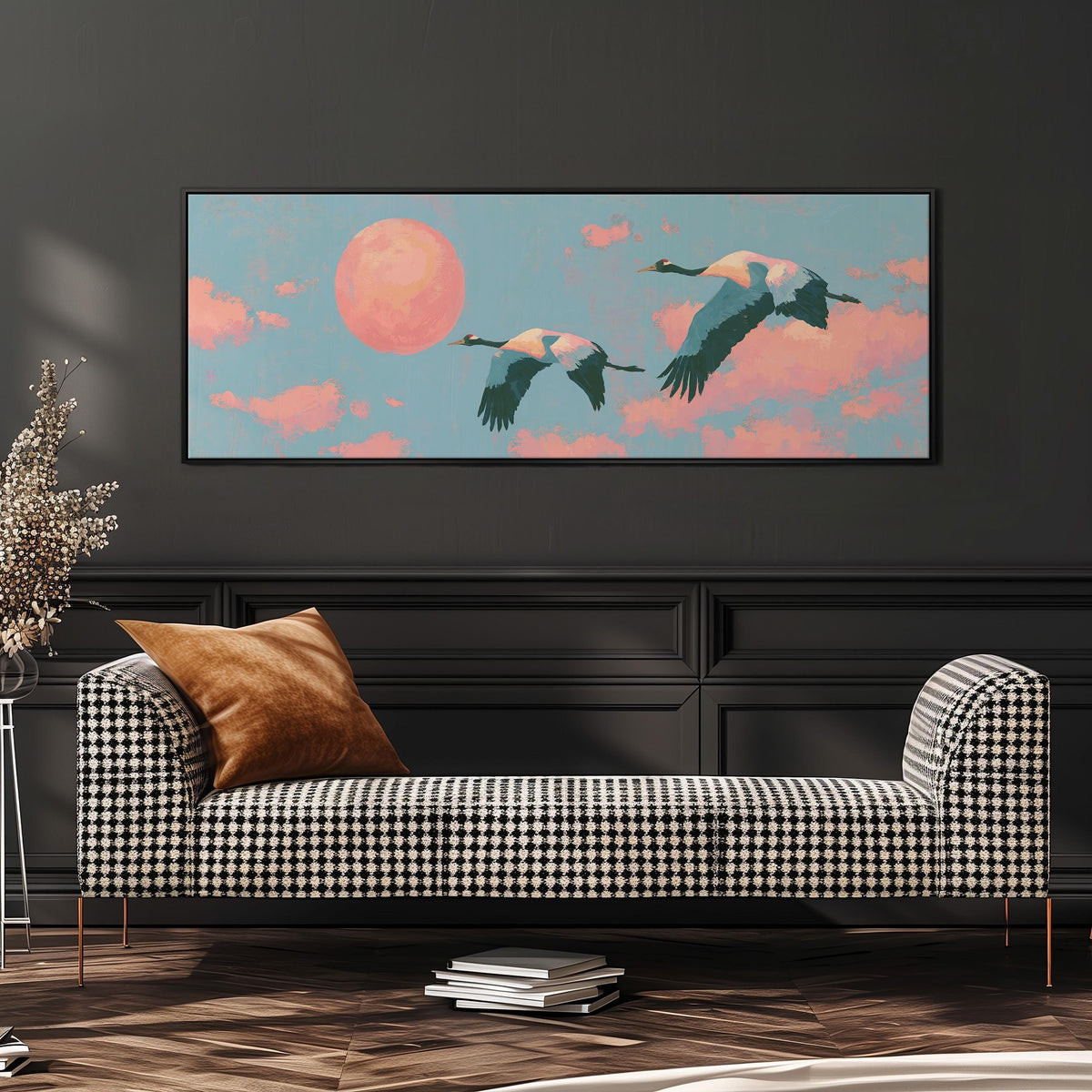 Two cranes flying at sunset wide panoramic canvas print above a bench in a dark living room