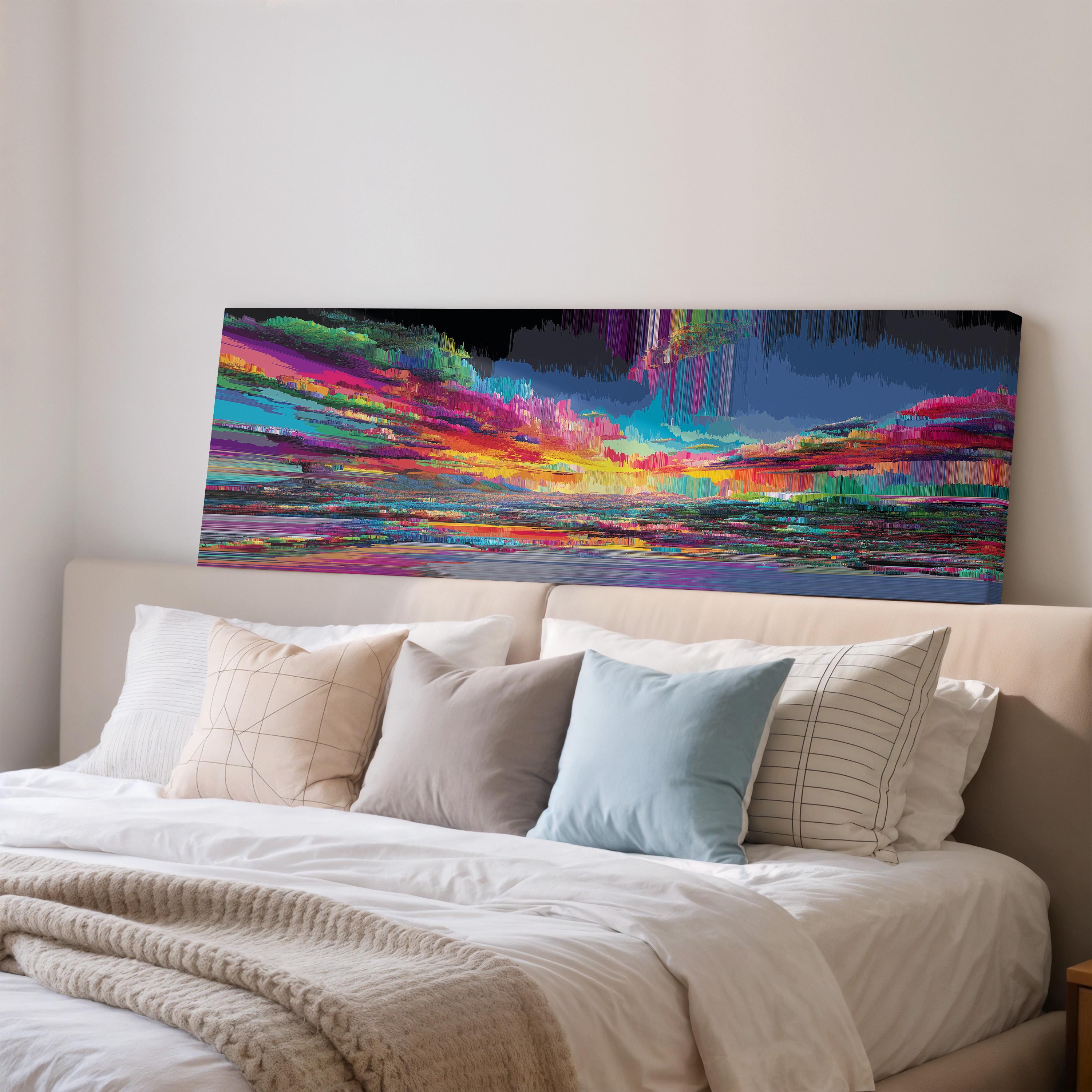 a large, colorful abstract painting hanging on a wall above a bed with white pillows and a gray blanket.