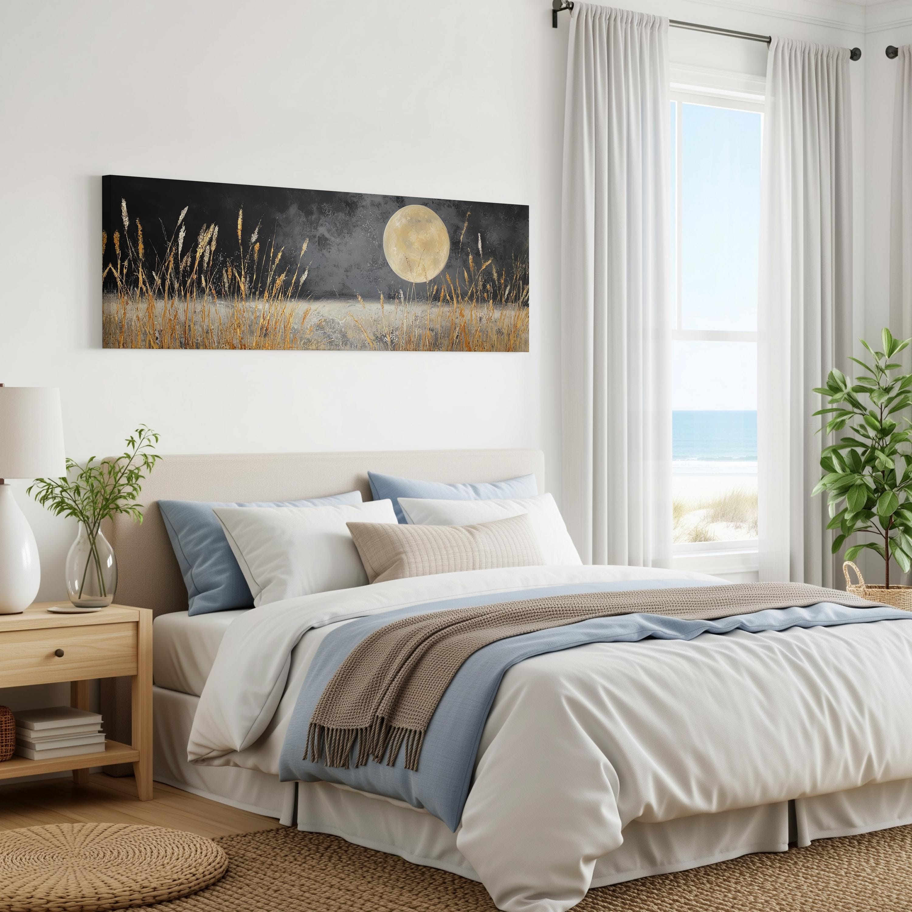 a serene bedroom scene with a large bed, a nightstand, and a painting of a field with a full moon. The room has white walls and a window overlooking the ocean, creating a peaceful and relaxing atmosphere.