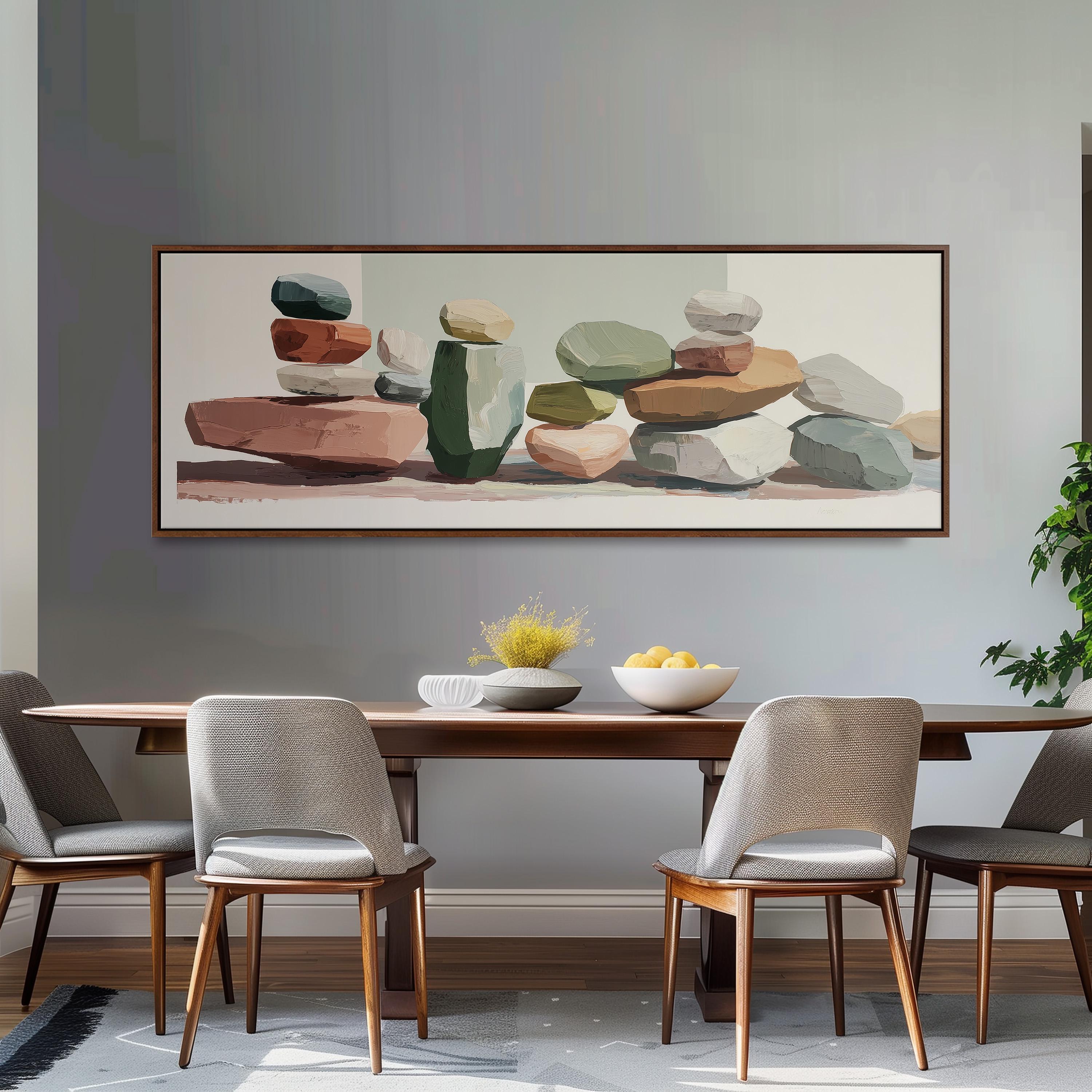 a dining room with a wooden table and four chairs. Above the table, there is a large painting depicting a collection of colorful rocks and stones. The painting is framed and hangs on the wall above the table.