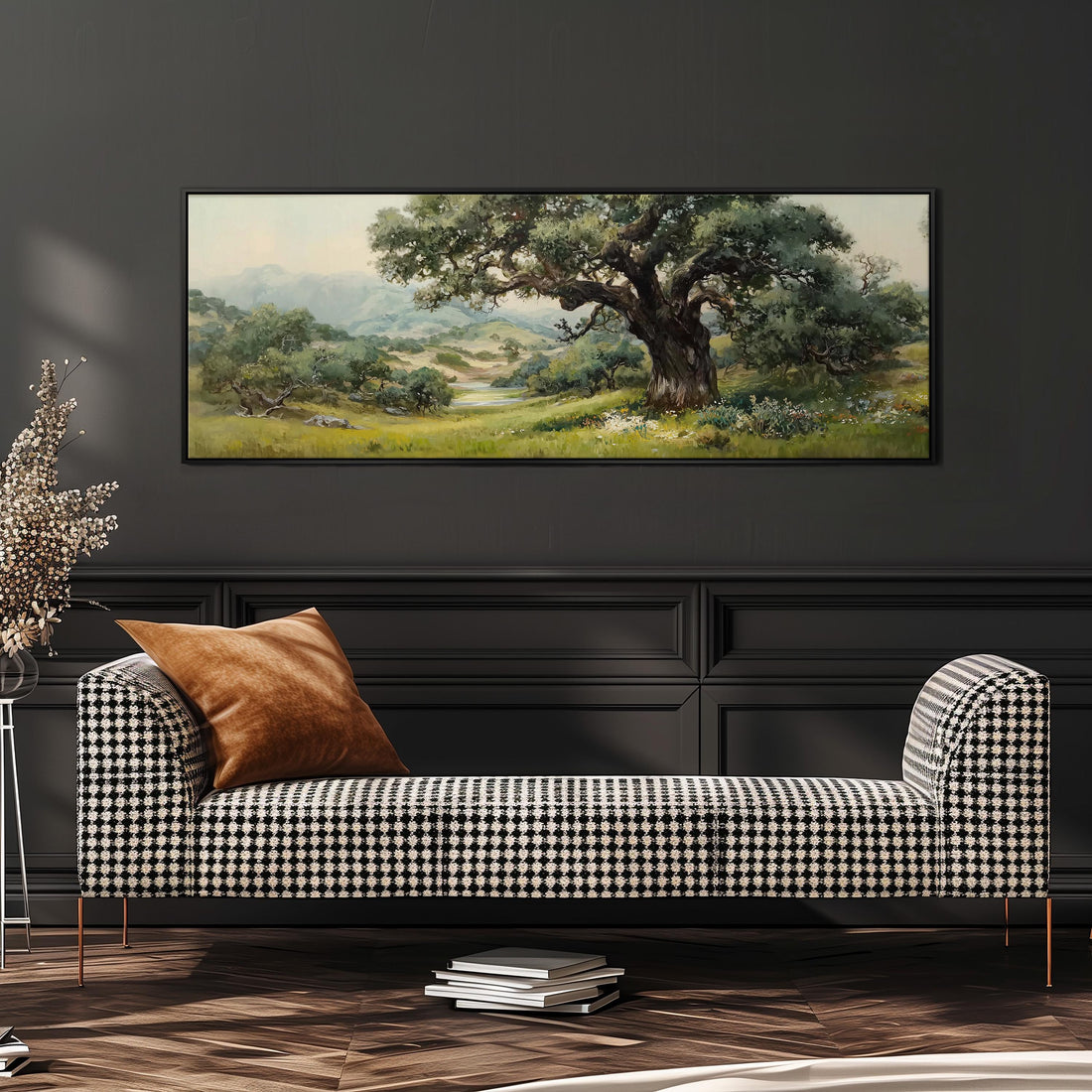 a large painting of a lush green landscape hanging on a wall above a brown sofa with orange cushions.