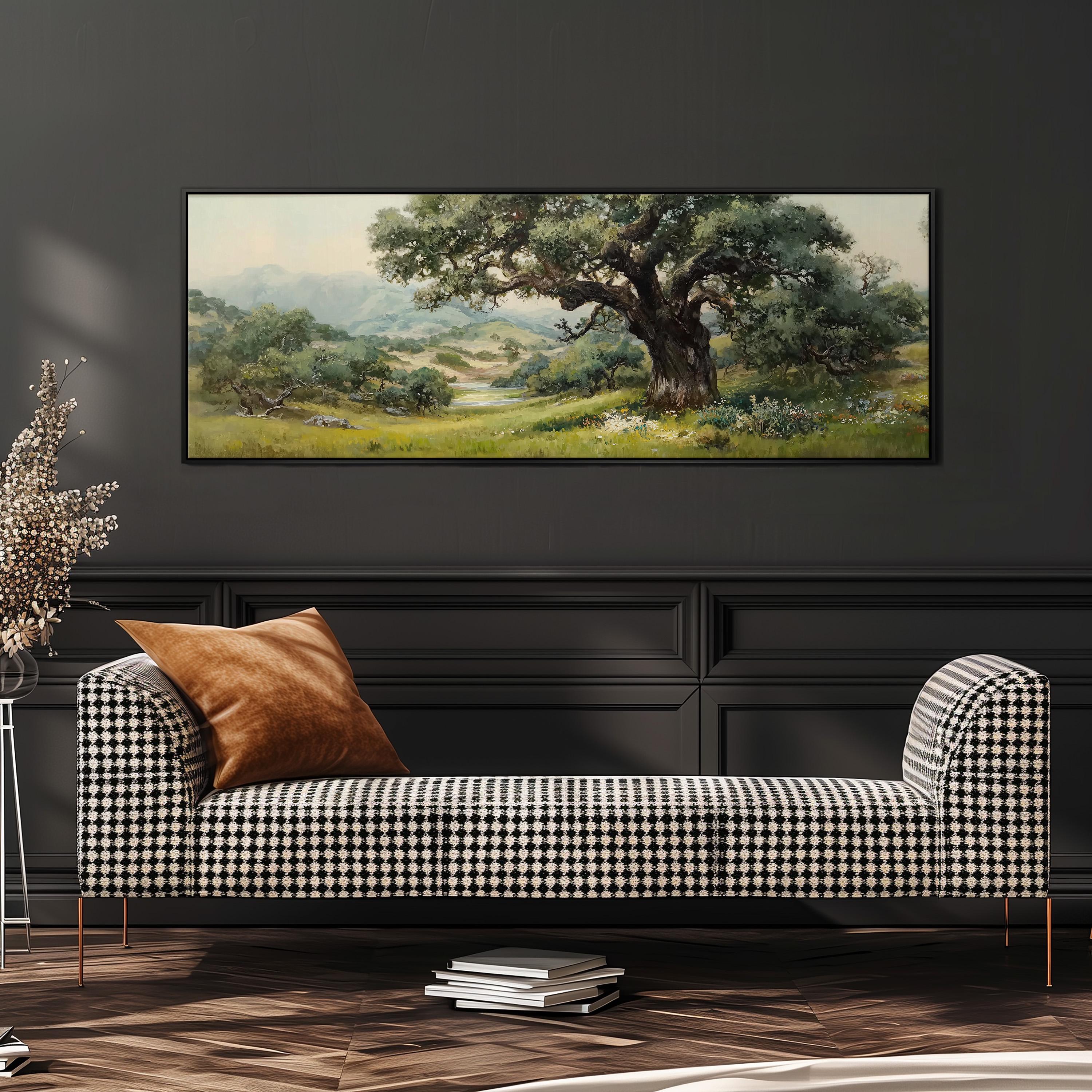 a large painting of a tree in a field hanging on a wall above a black and white checkered sofa with a brown throw pillow.