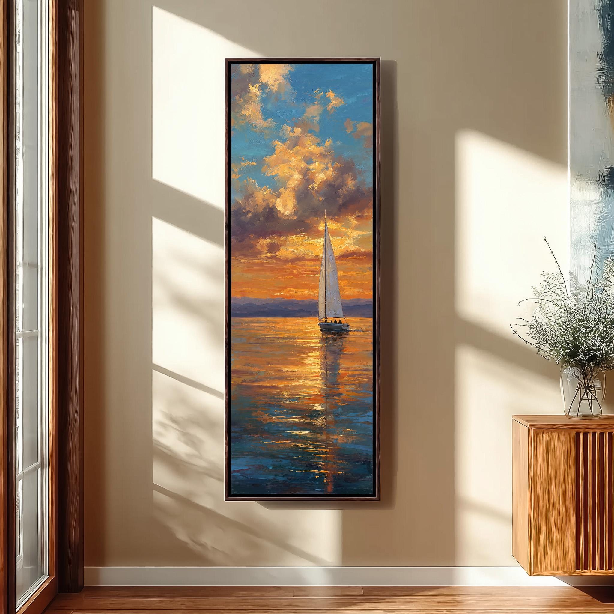 a large painting of a sailboat on the water, with a vibrant sunset in the background. The painting is hung on a wall, and there is a vase of flowers next to it.