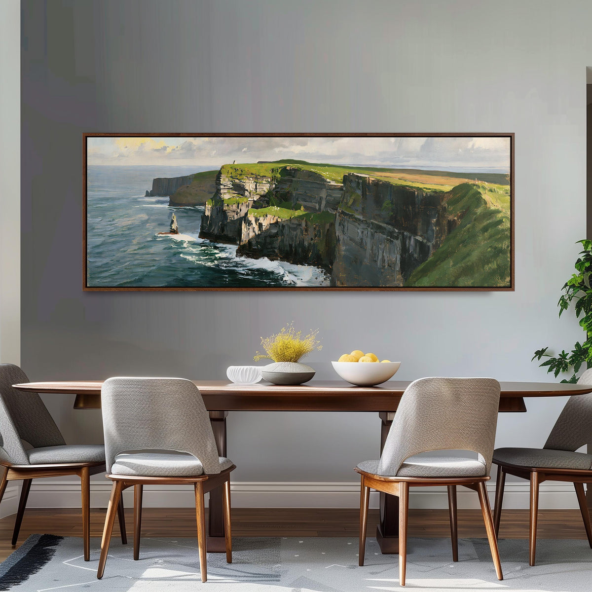 Sunlit sea cliffs with a sea stack long horizontal canvas print above a dining table