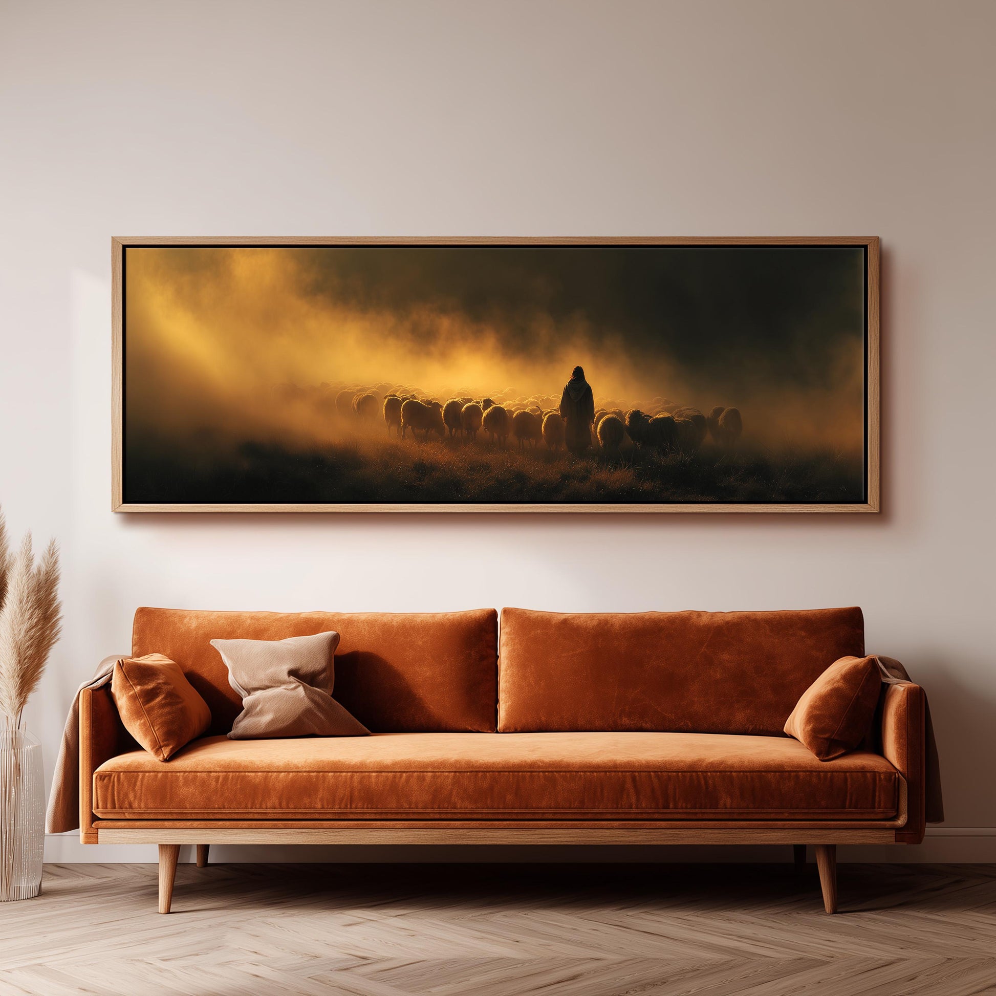 a large, framed painting hanging on a wall above a brown sofa.