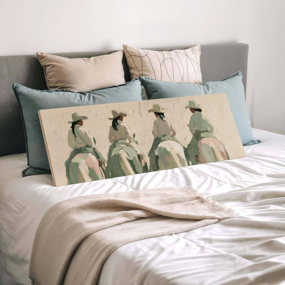 Cowgirl trail riders wide panoramic canvas print laid on a bed to show its size