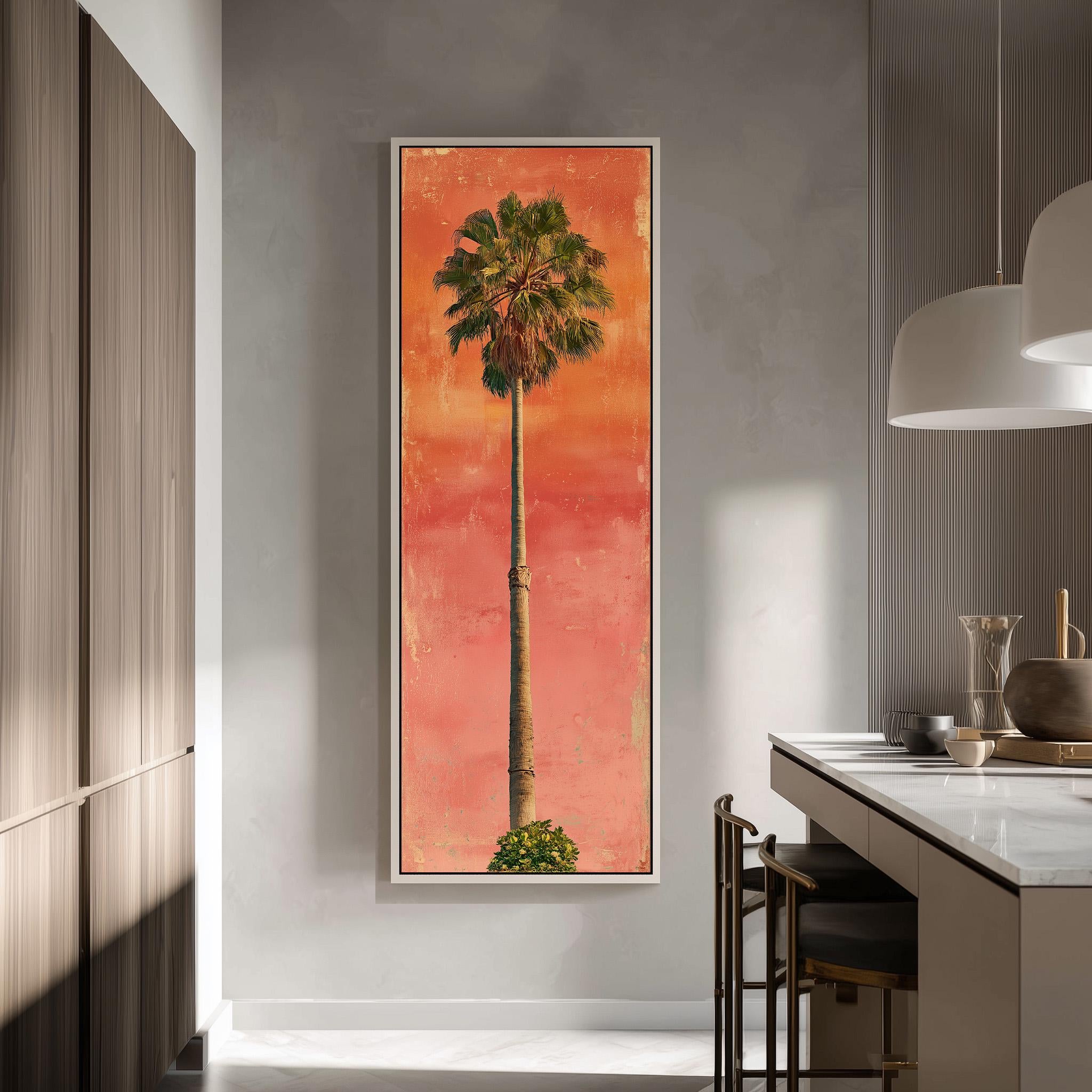 a large framed painting of a palm tree on a wall, with a warm orange and red background.
