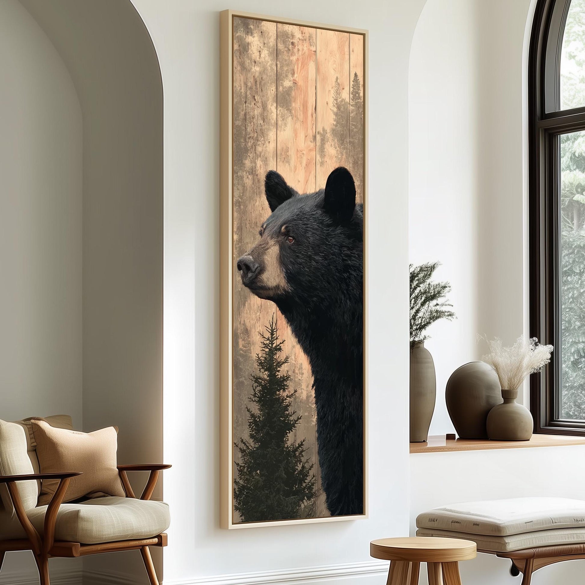 a large framed painting of a black bear in profile, hanging on a wall in a room with a wooden chair and a window.
