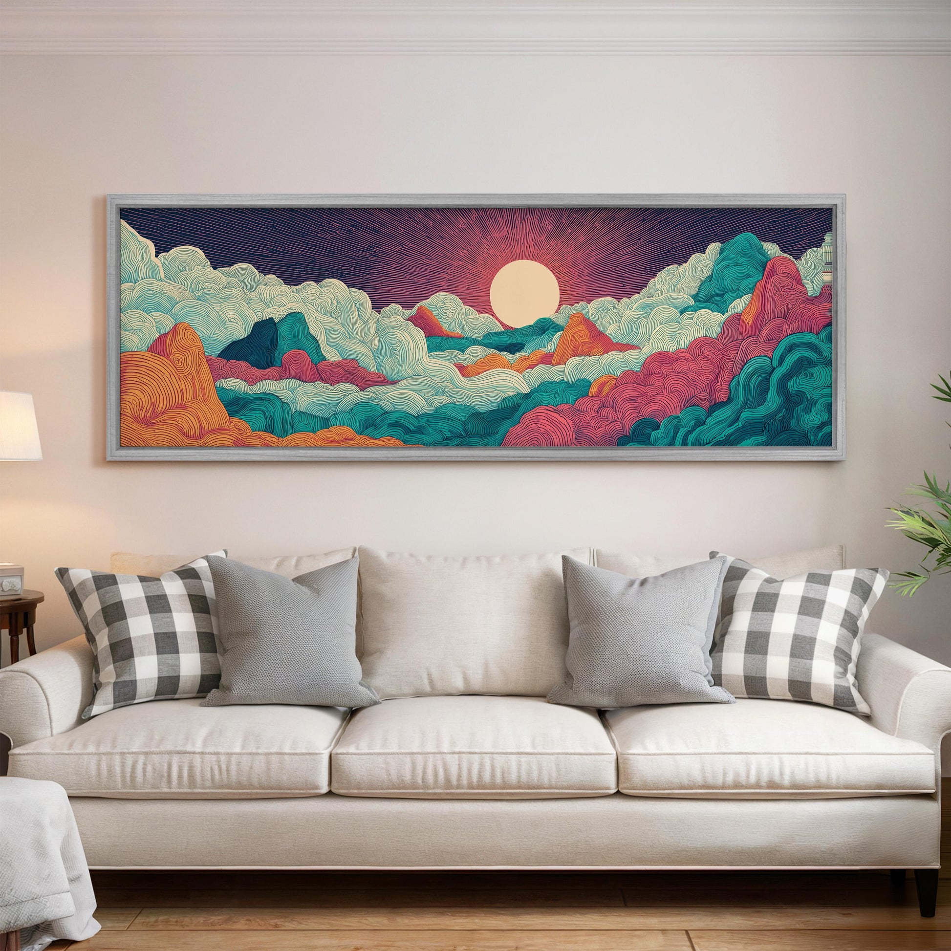 a large, colorful painting of a mountainous landscape hanging on a wall above a white couch with patterned throw pillows.
