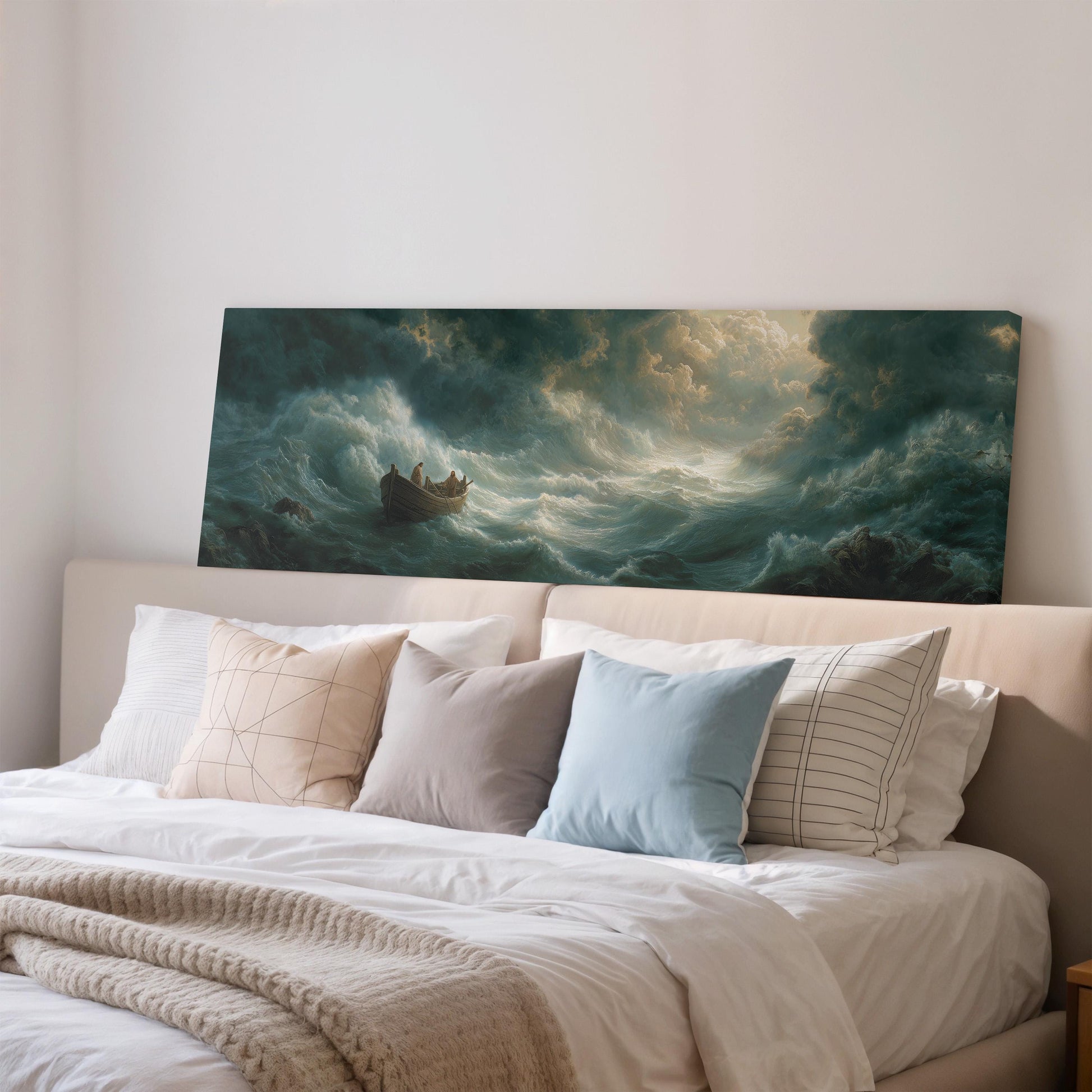 a large painting of a stormy sea with a boat in the center, hanging on a wall above a bed with white bedding and pillows.
