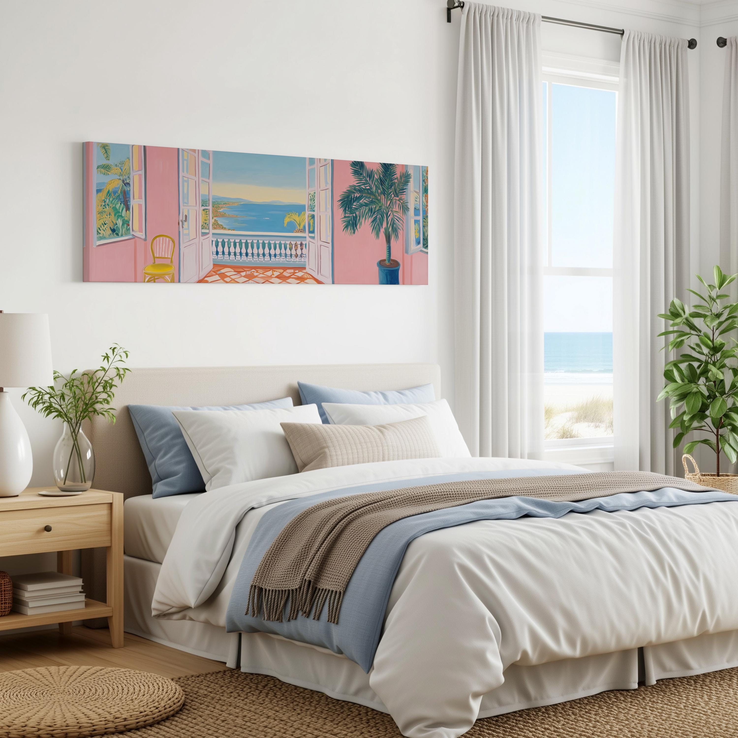 a serene bedroom with a large bed, a painting of a balcony overlooking the ocean, and a window with white curtains. The room has a neutral color palette with pops of color from the artwork and the potted plant.