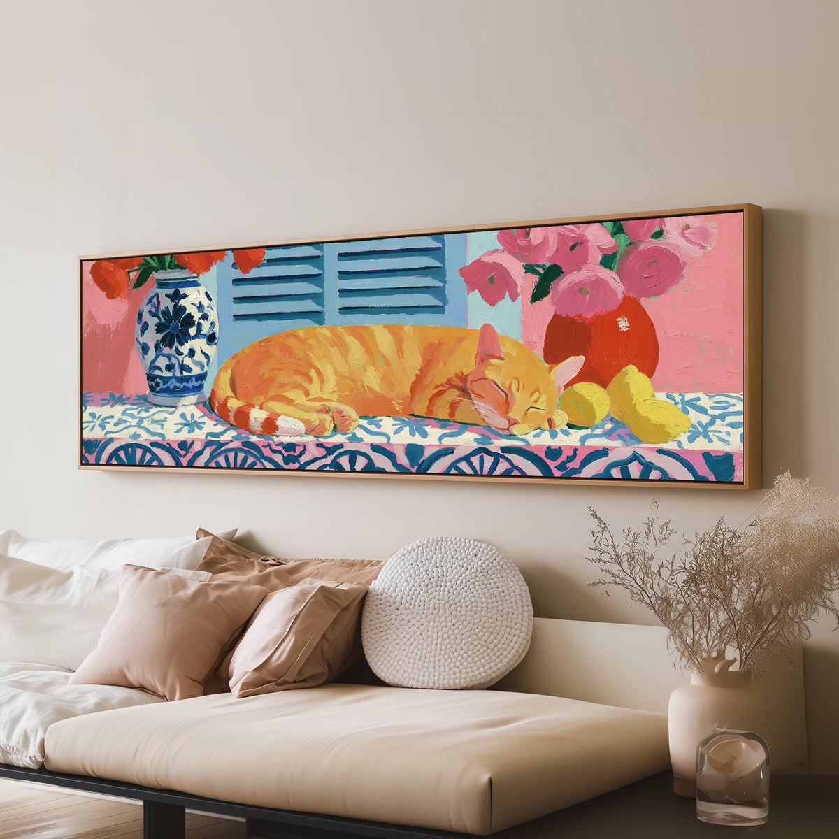 Orange cat napping on a tiled table panoramic canvas print above a sofa in a living room