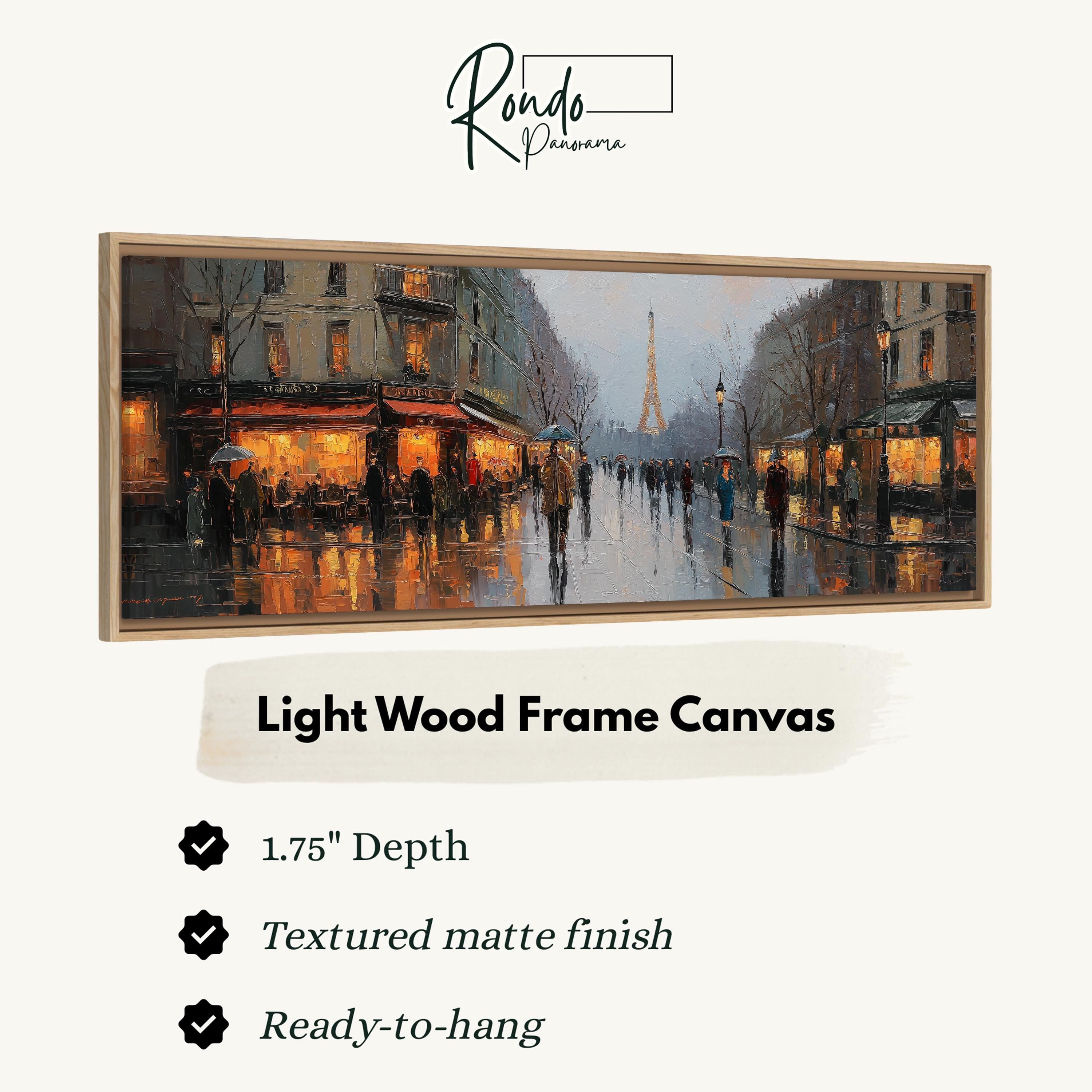 The image is a framed painting depicting a rainy city street scene with people walking and buildings illuminated by warm lighting.