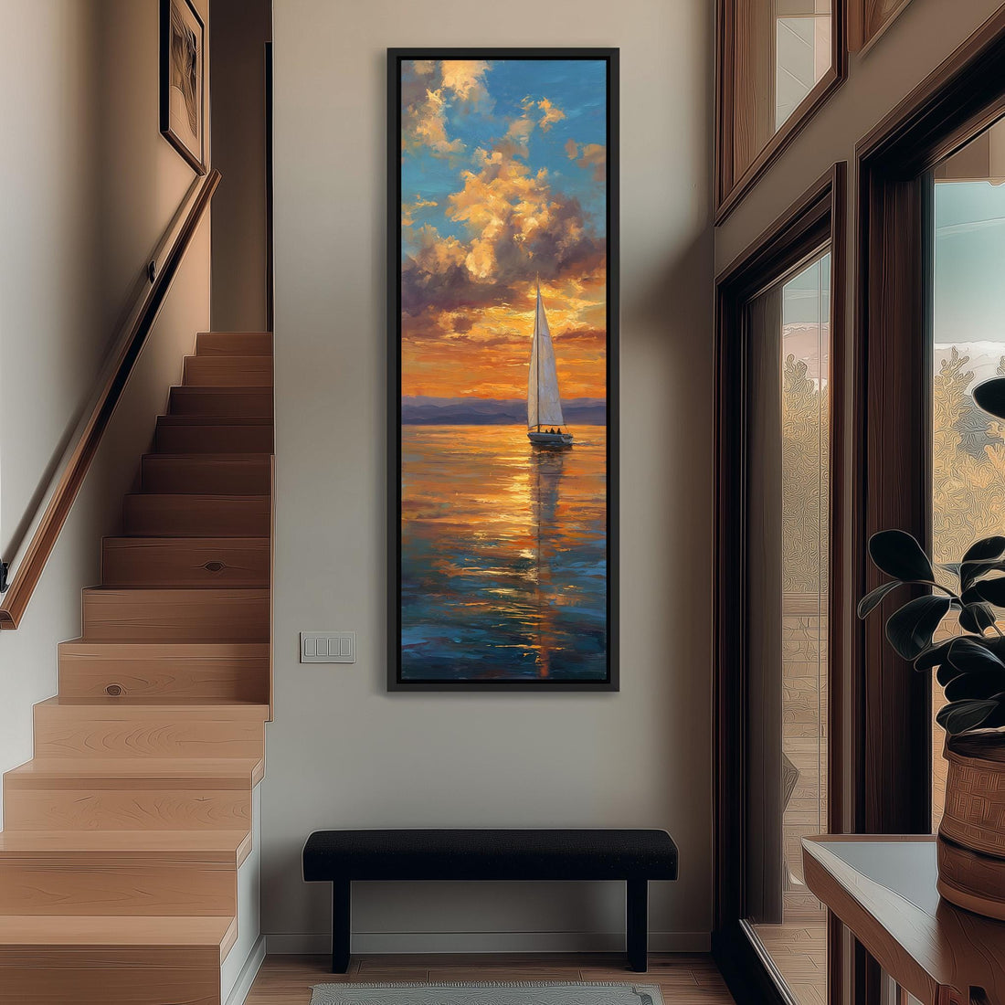 a large painting of a sailboat on the water, with a vibrant sunset in the background. The painting is hung on a wall, and there is a vase of flowers next to it.