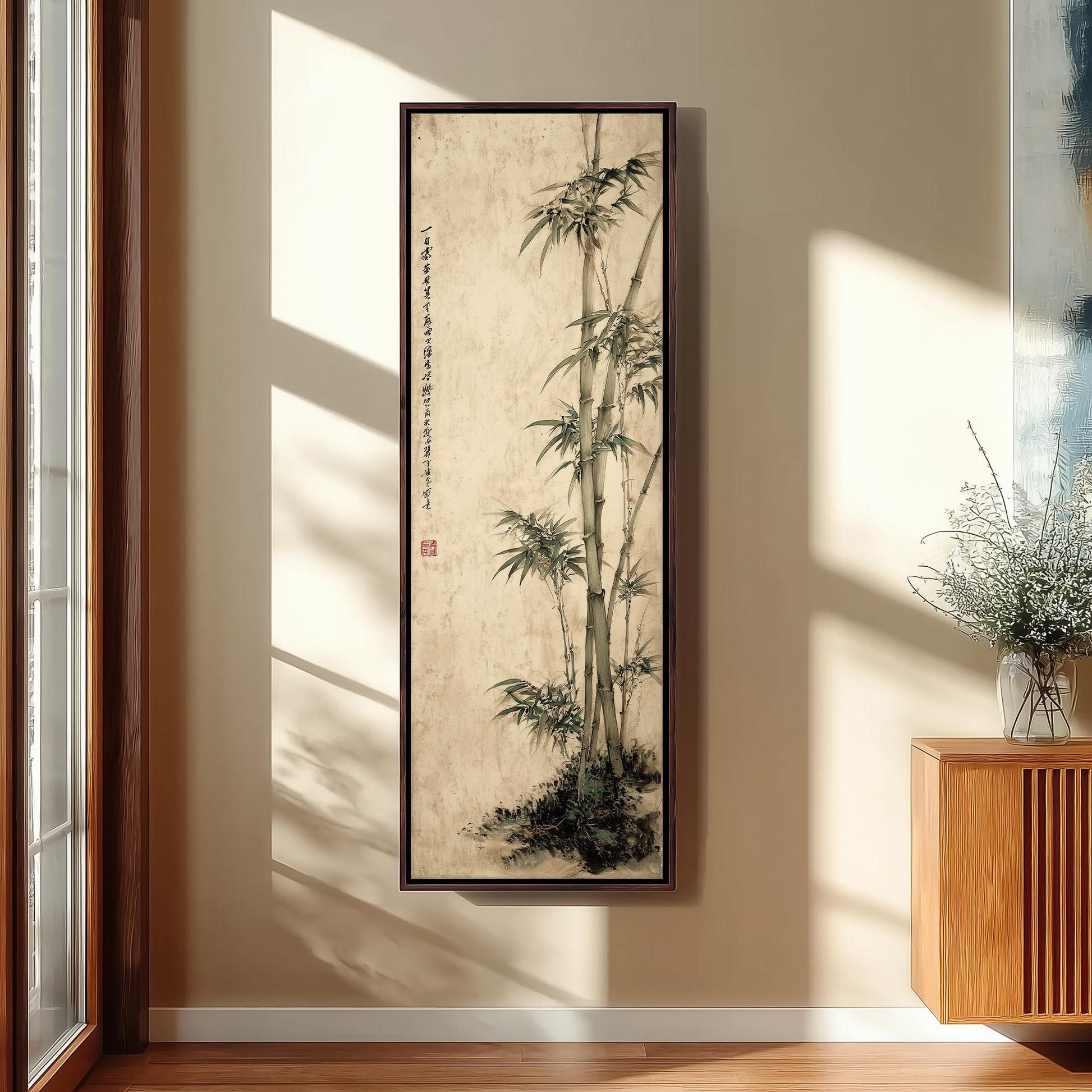 a large framed painting of bamboo plants hanging on a wall in a room with wooden furniture.