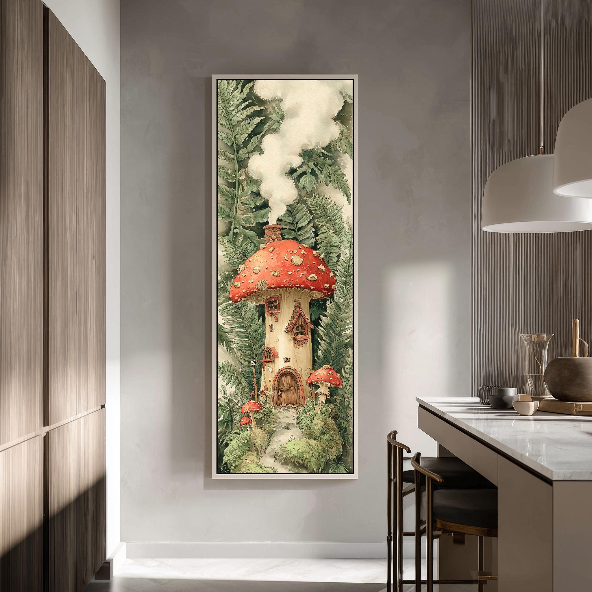 a large framed painting of a mushroom house surrounded by lush greenery, hanging on a wall in a room with a kitchen counter and chairs.