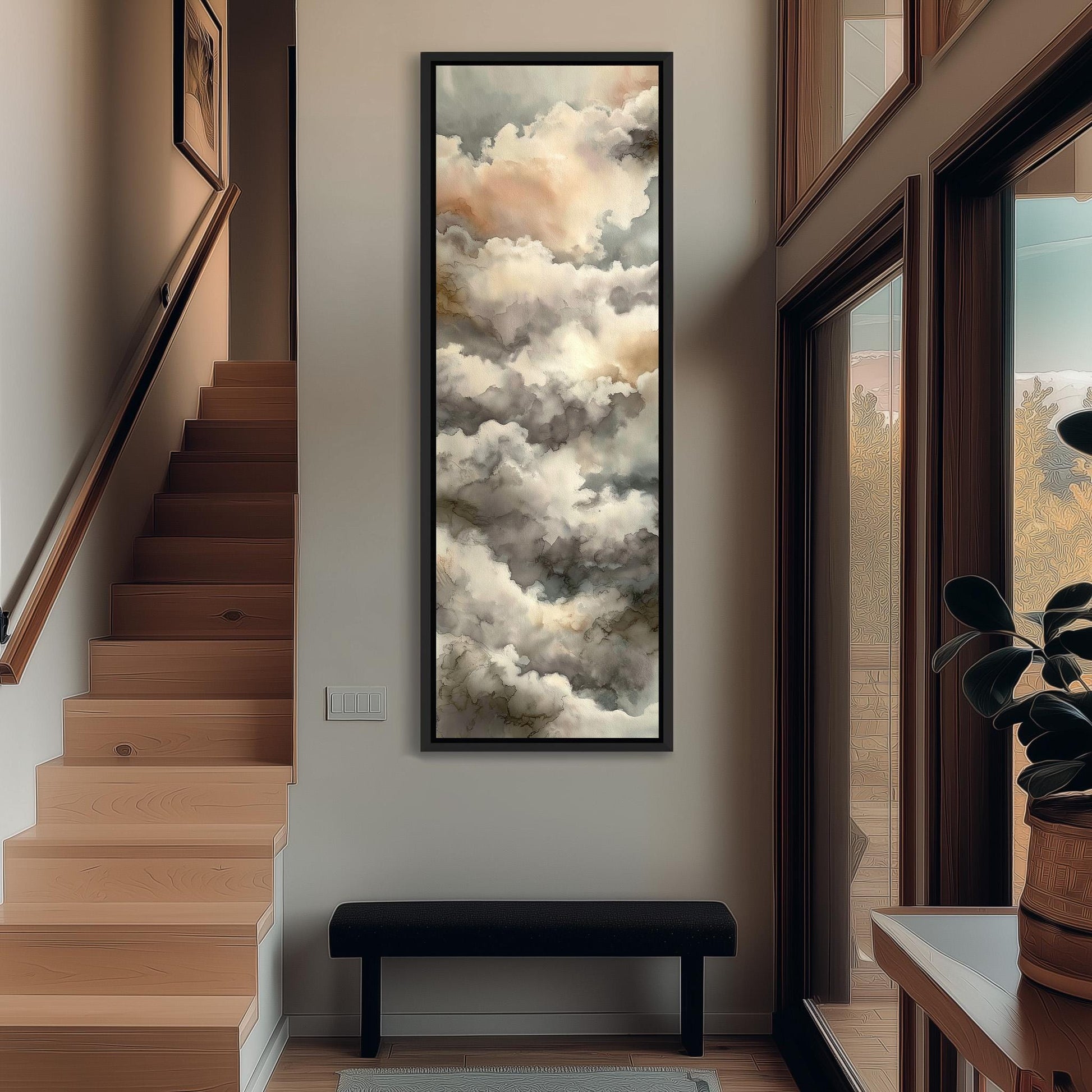 a hallway with a large painting of clouds hanging on the wall, a wooden staircase, a black bench, and a plant in a pot.