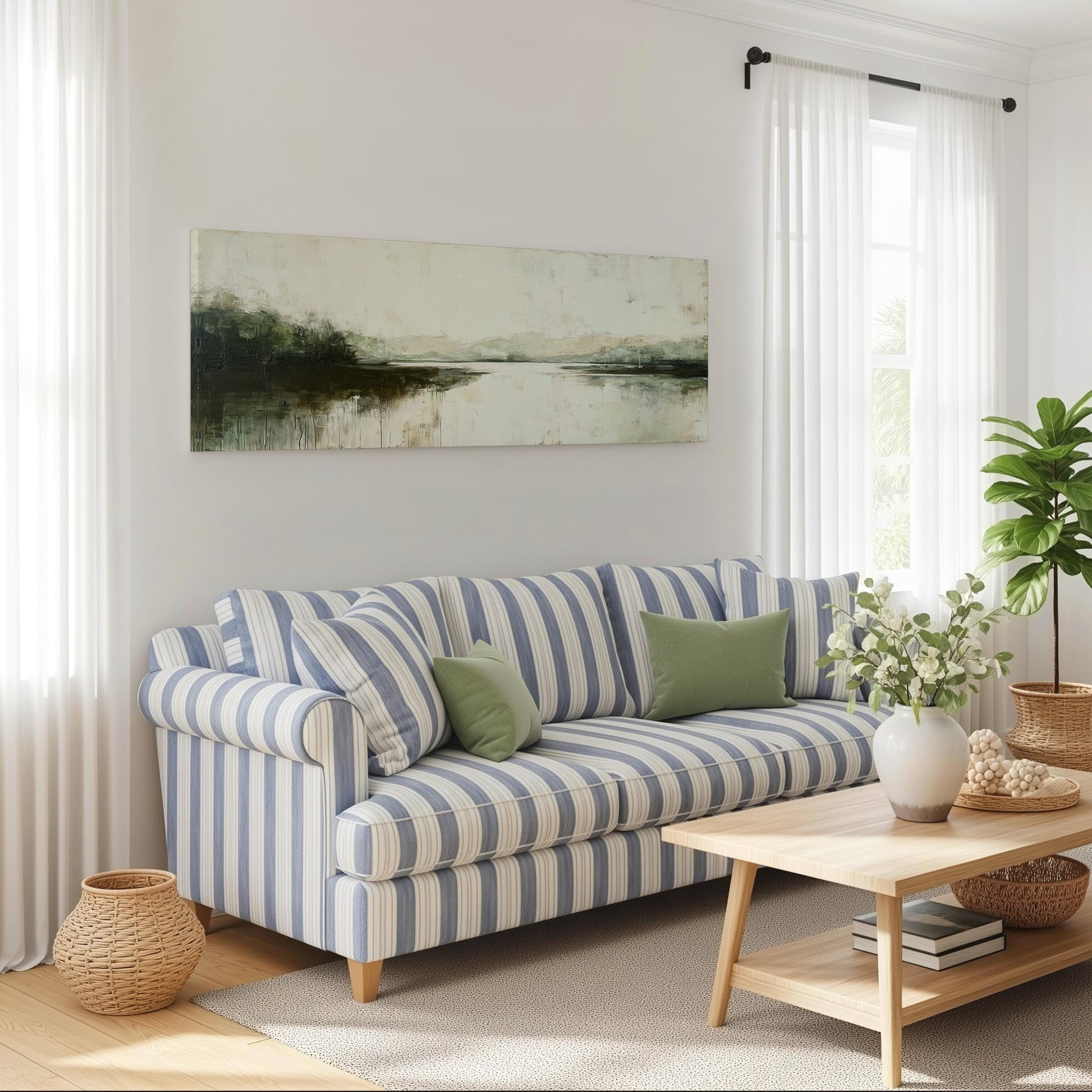 a cozy living room with a striped blue and white sofa, a wooden coffee table, and a large window with white curtains. Above the sofa, there is a painting of a landscape. The room also features a potted plant and a basket on the floor.