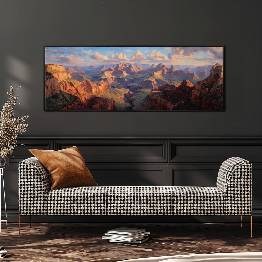 a large, framed painting of a mountainous landscape hanging on a wall above a brown sofa.