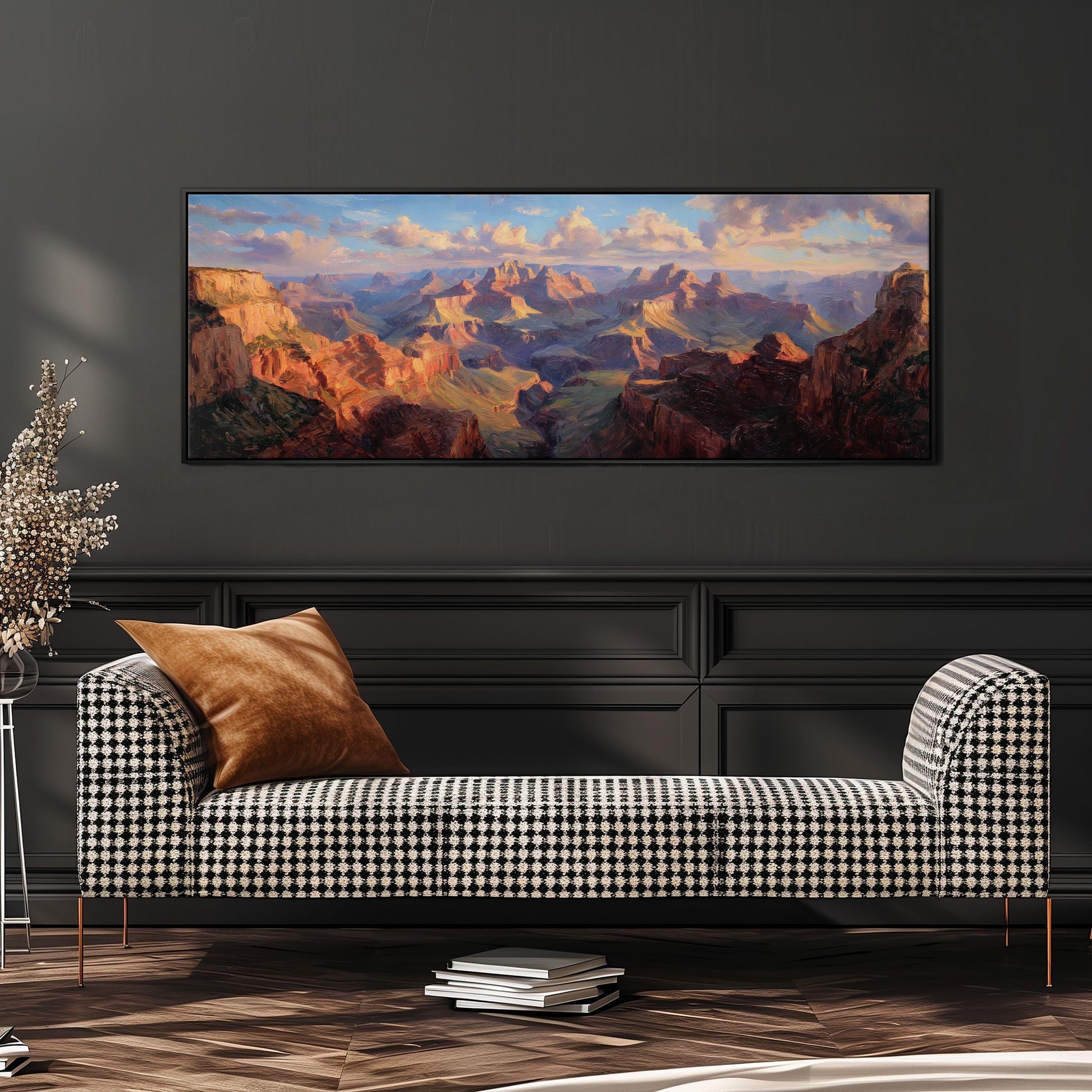 a large, colorful painting of a mountainous landscape hanging on a wall above a black and white checkered sofa in a modern living room setting.