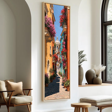 Colorful street with flowered balconies long vertical canvas print in a sunlit living space