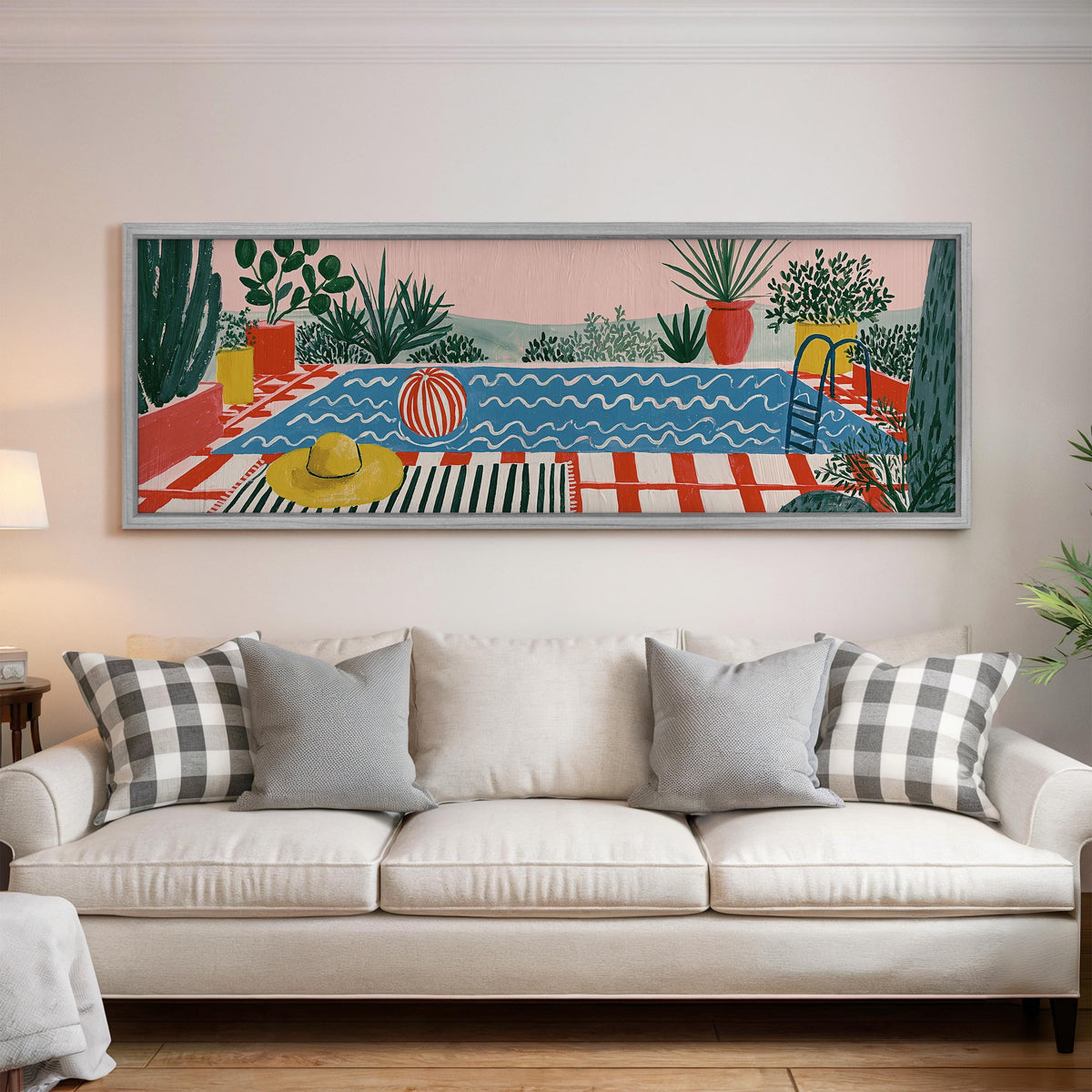 Colorful poolside courtyard panoramic canvas print above a white sofa in a bright living room
