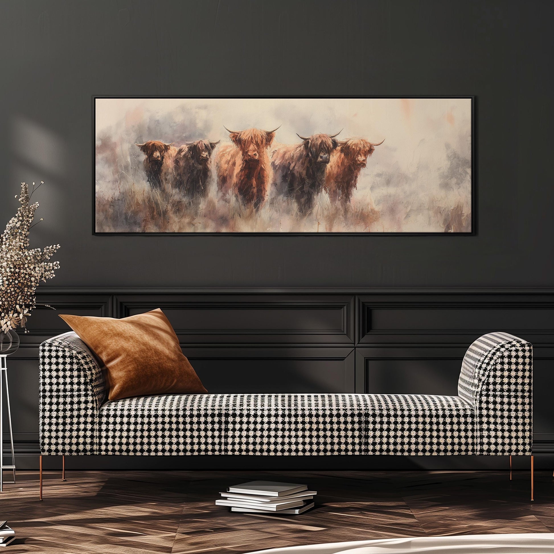 a large painting of five yaks on a wall, with a checkered sofa in the foreground.